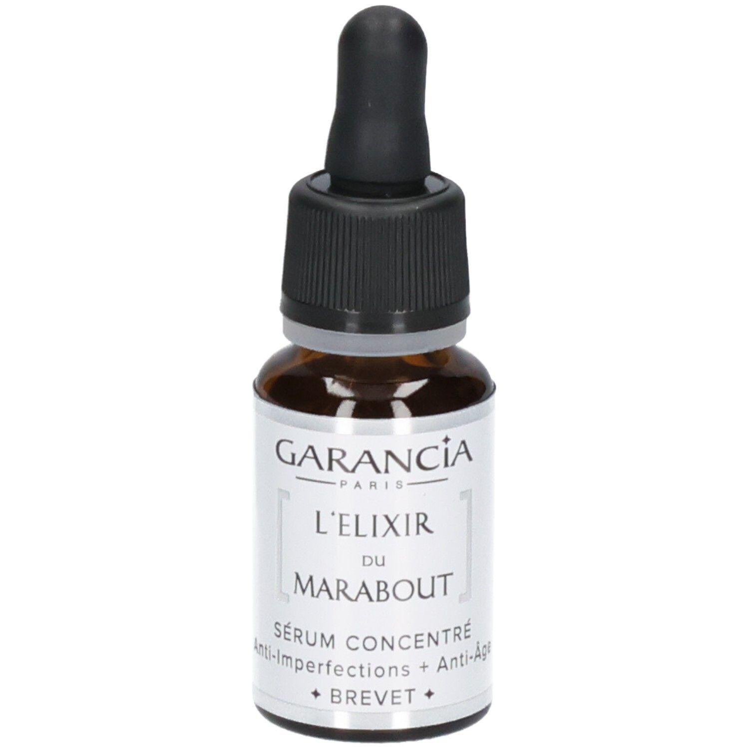 Garancia L'elixir Du Marabout Serum: Braunglasflasche mit Pipettenverschluss. Etikett mit Produktnamen und 'Sérum Concentré Anti-Imperfections + Anti-Age'.