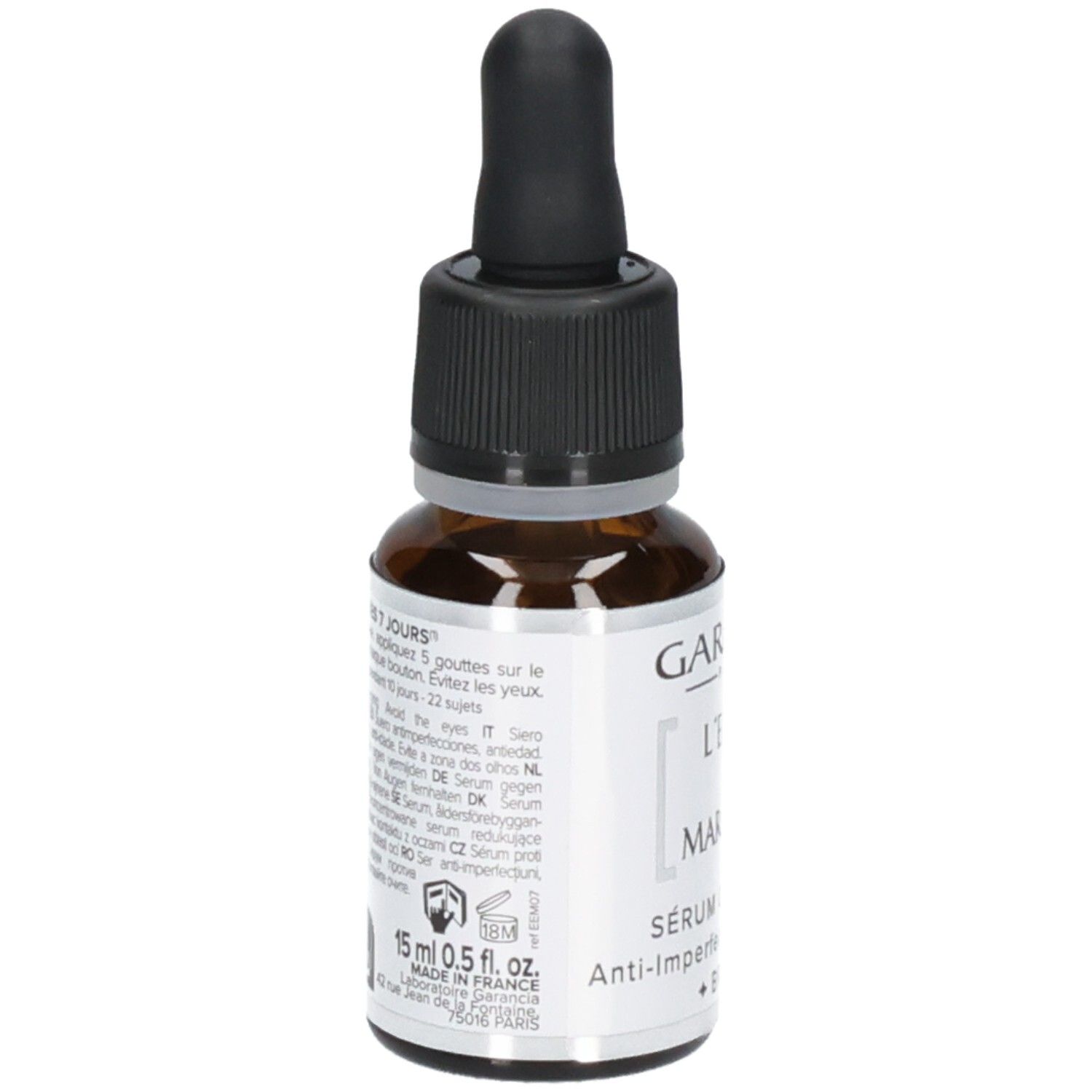 Garancia L'elixir Du Marabout Serum: Rückseite der Flasche mit Anwendungshinweisen und Produktinformationen in mehreren Sprachen.