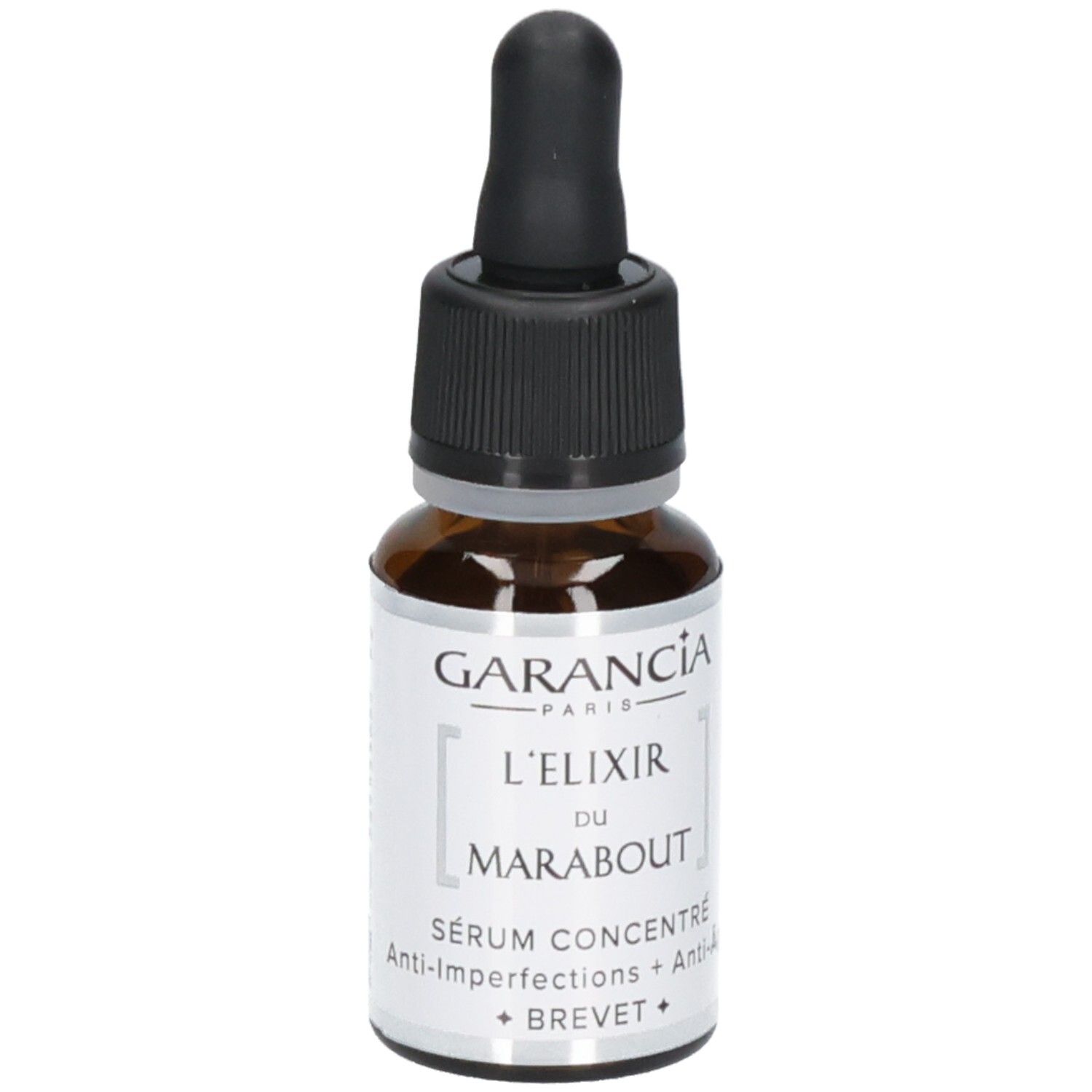 Garancia L'elixir Du Marabout Serum: Braunglasflasche mit Pipettenverschluss. Etikett mit Produktnamen und 'Sérum Concentré Anti-Imperfections + Anti-Age'.
