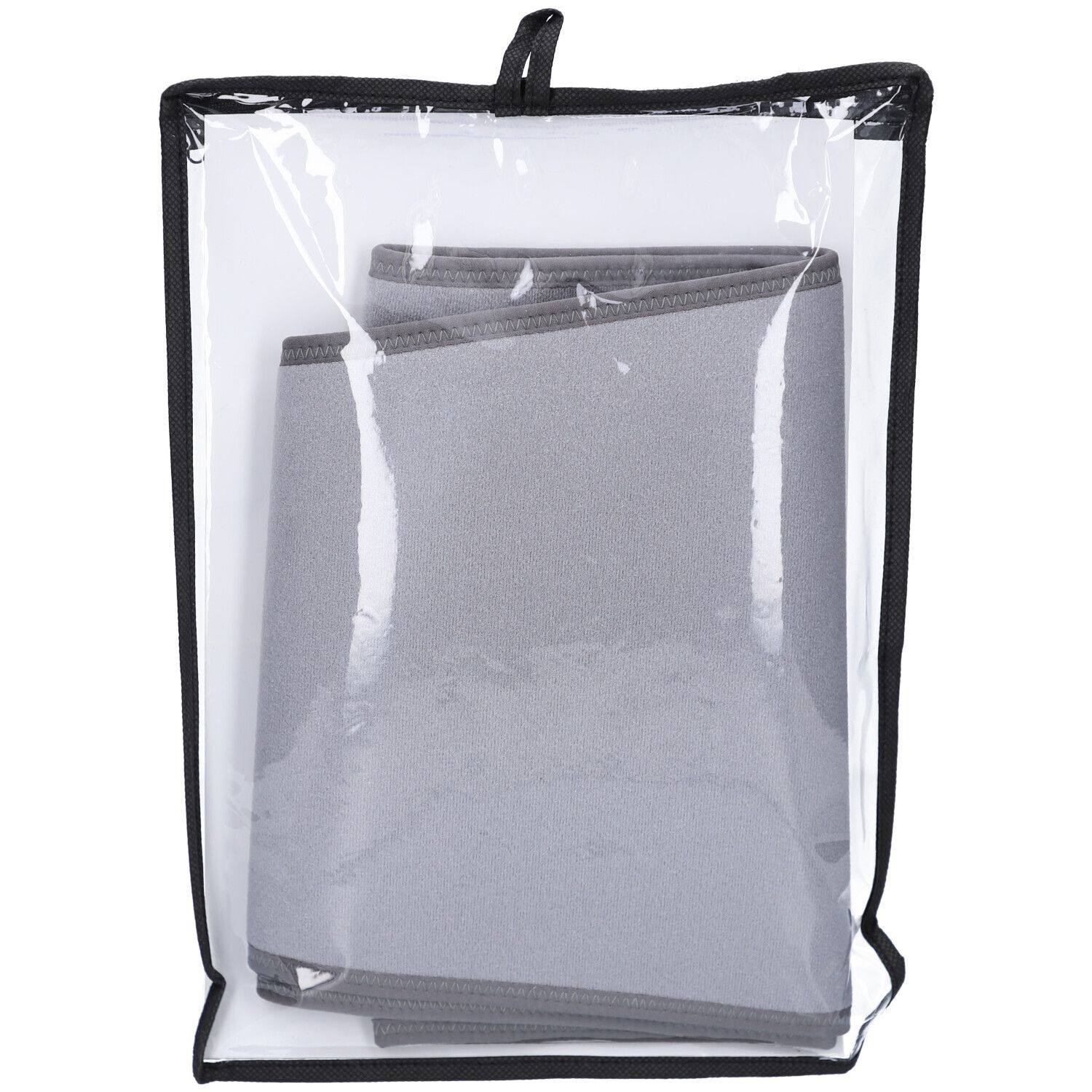 Gefaltete Rückenbandage in transparenter Tasche. Graues Material, schwarzer Rand. Schwarzer Tragegriff.