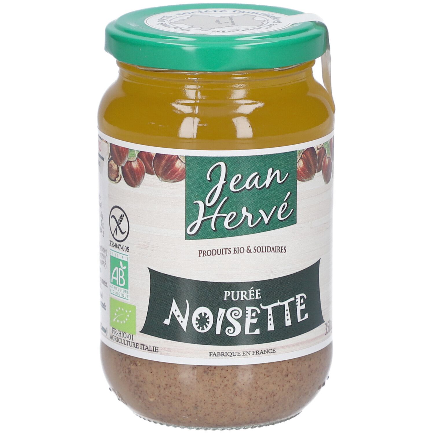 Glas mit Haselnussmus. Grün-weißes Etikett mit Logo und Schriftzug. Glutenfrei-Zeichen.