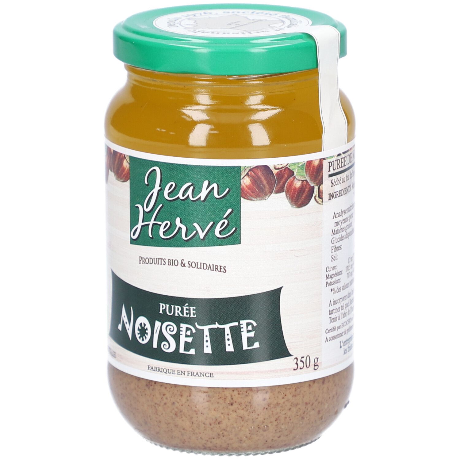 Glas mit Haselnussmus. Etikett mit Logo und Schriftzug. 350g. Grün-weiße Kappe.