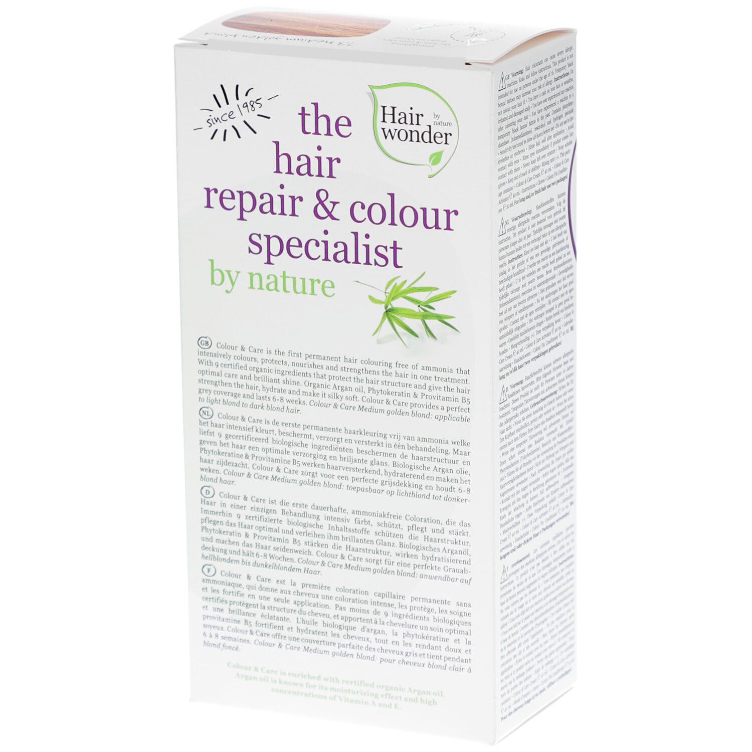 Boîte de coloration capillaire, vue latérale. Inscription : the hair repair & colour specialist by nature. Texte multilingue.