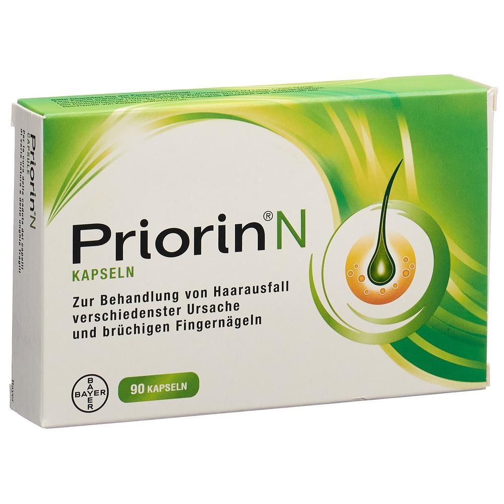 Weiße Schachtel mit grünem Deckel. Aufschrift: Priorin N Kapseln. Enthält 90 Kapseln. Bayer-Logo. Abbildung eines Haares.