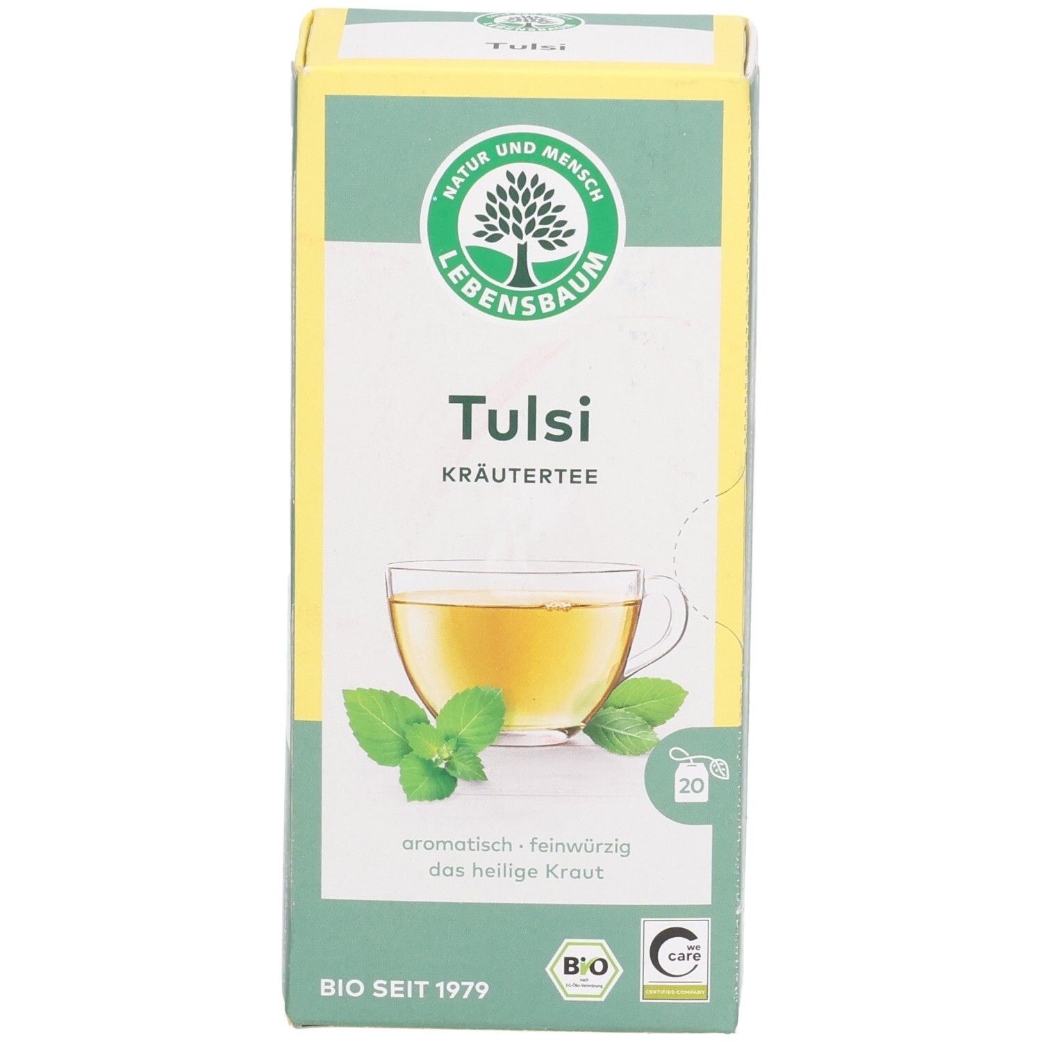 LEBENSBAUM Tulsi Kräutertee-Verpackung. Grün-weißes Karton mit Logo, Produktname, Teetasse-Illustration und 20 Teebeuteln.