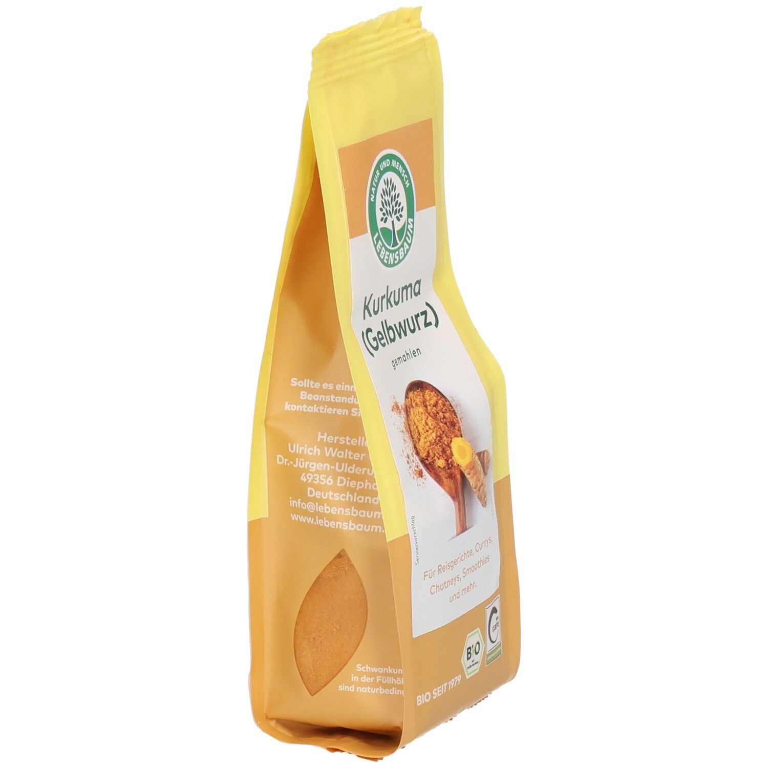 Sachet de curcuma jaune, en biais. Inscription : Curcuma (Gelbwurz) moulu. Label bio. Texte et logo Lebensbaum.