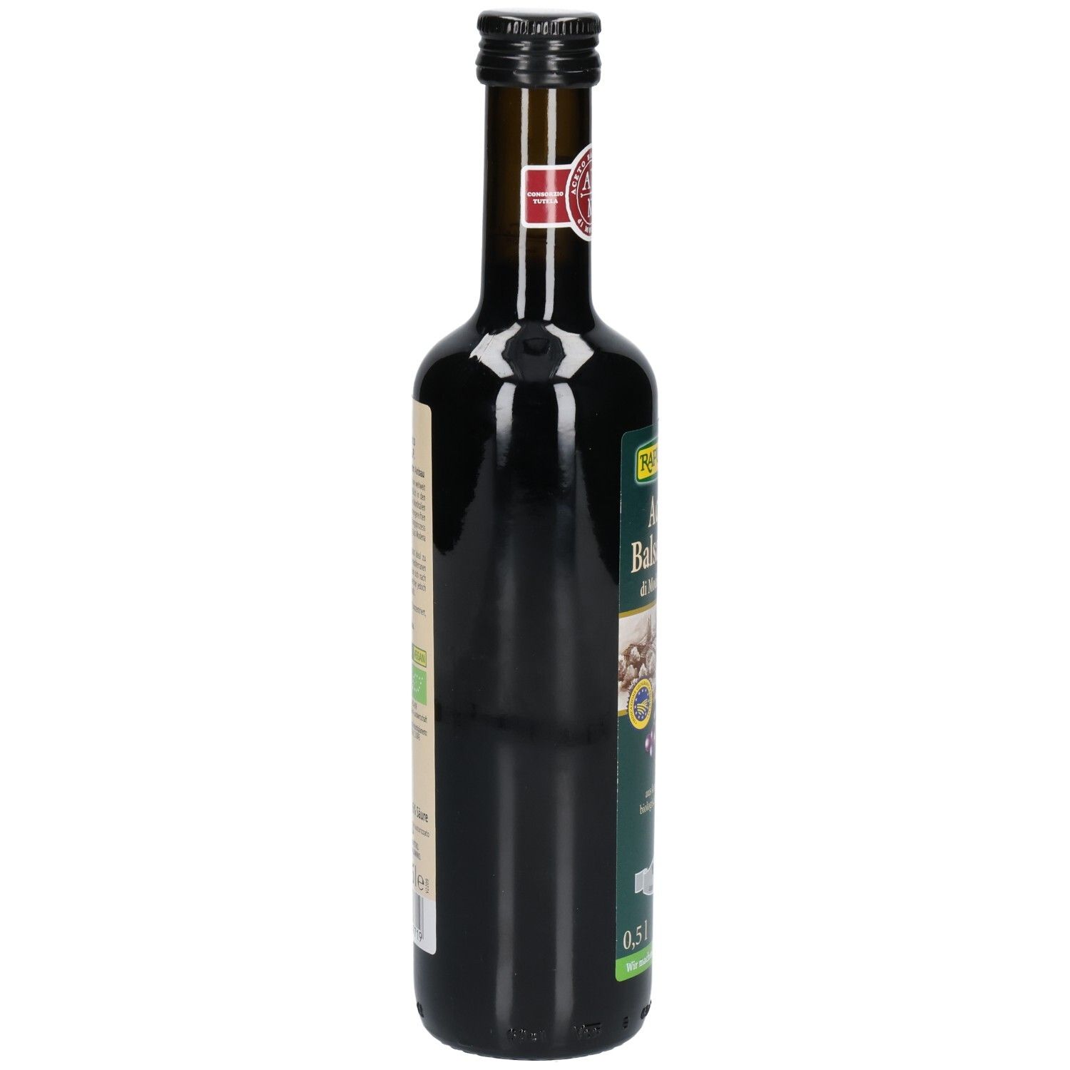 Bouteille en verre foncé, vue latérale. Étiquette avec texte. Bouchon noir. 0,5 l.