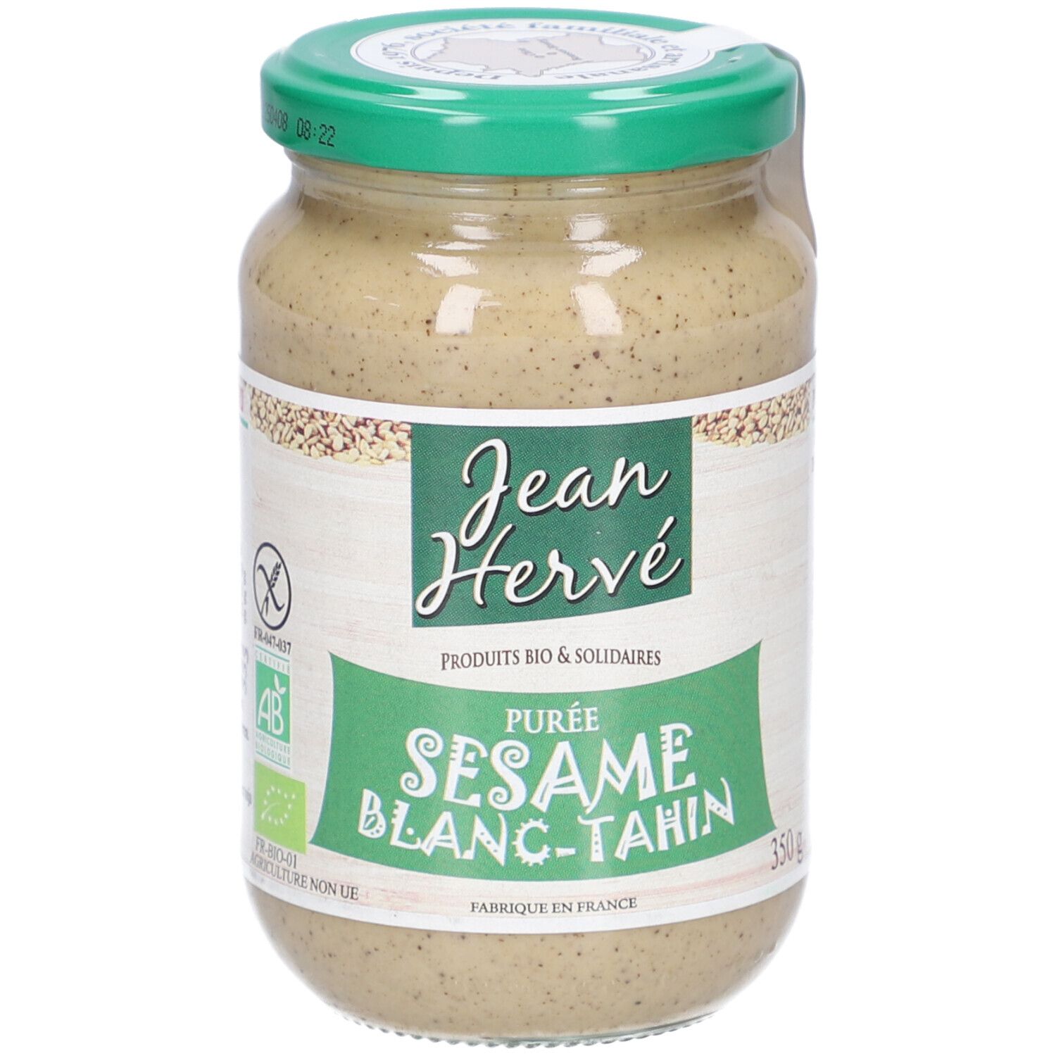 Pot de purée de sésame Jean Hervé. Étiquette verte et blanche. Inscription "Sesame Blanc-Tahini". Couvercle vert.