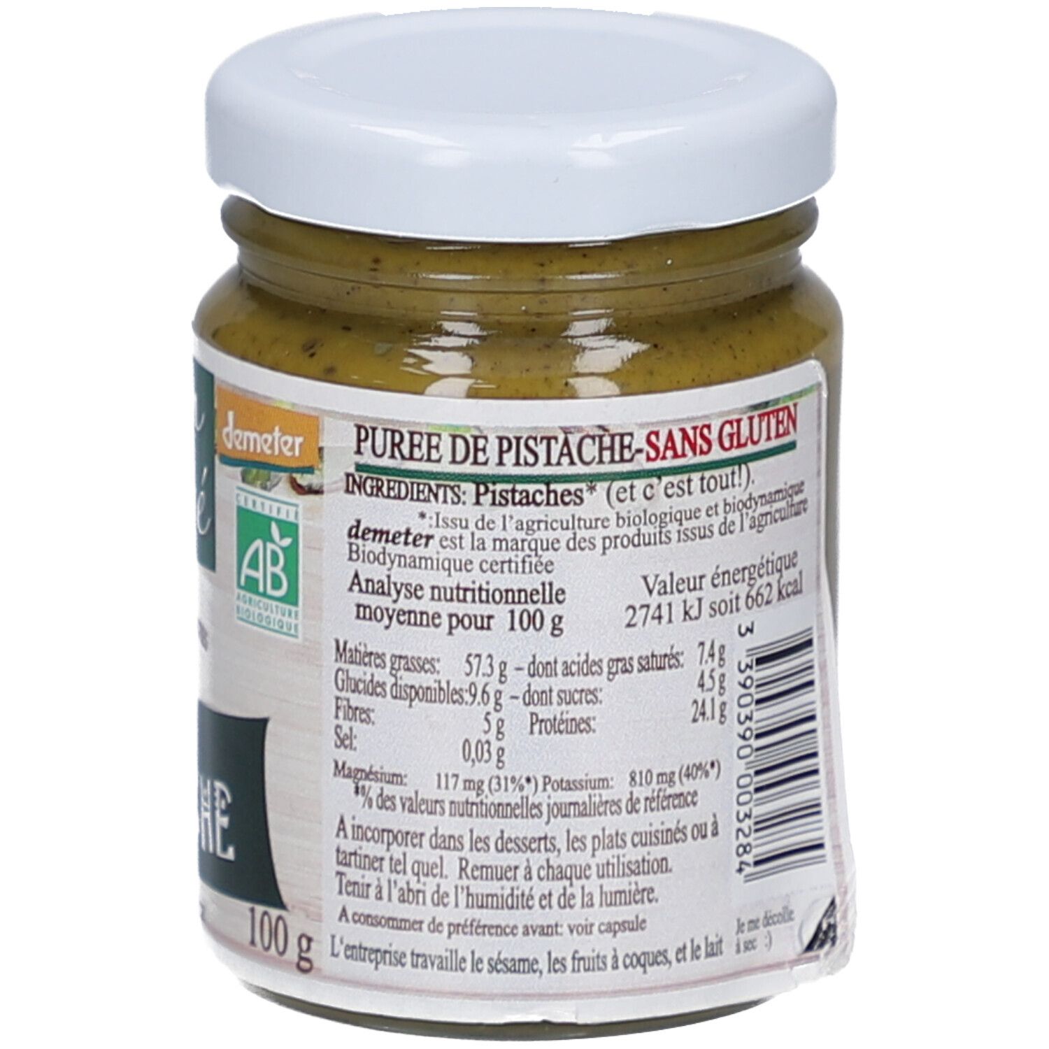 Dos du pot de purée de pistaches. Texte: "Purée de Pistache-sans gluten", informations nutritionnelles, label bio, et 100g.