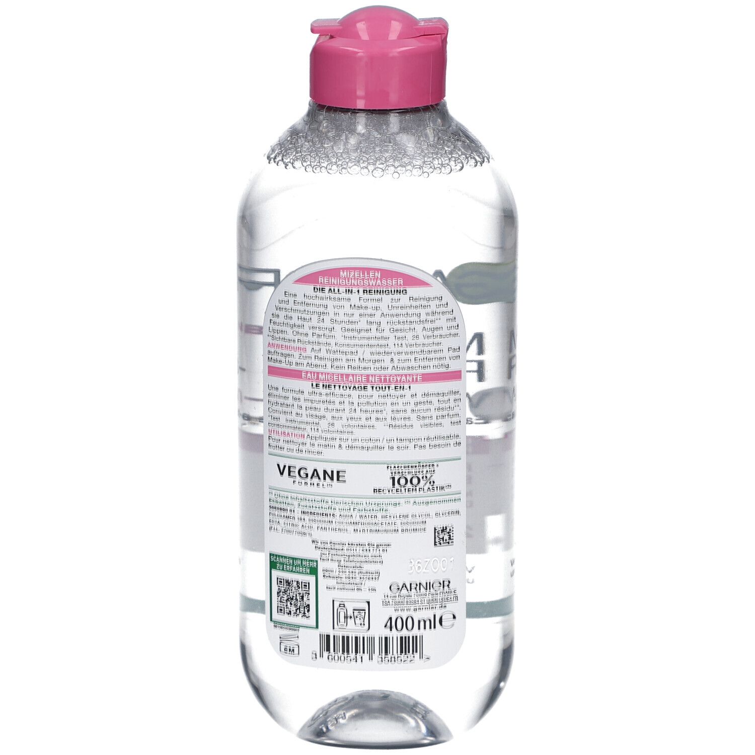 Rückseite der Flasche. Text auf rosa Etikett. Aufschrift: VEGANE FORMEL. 100% recycelbare Flasche. QR-Code und Barcode.