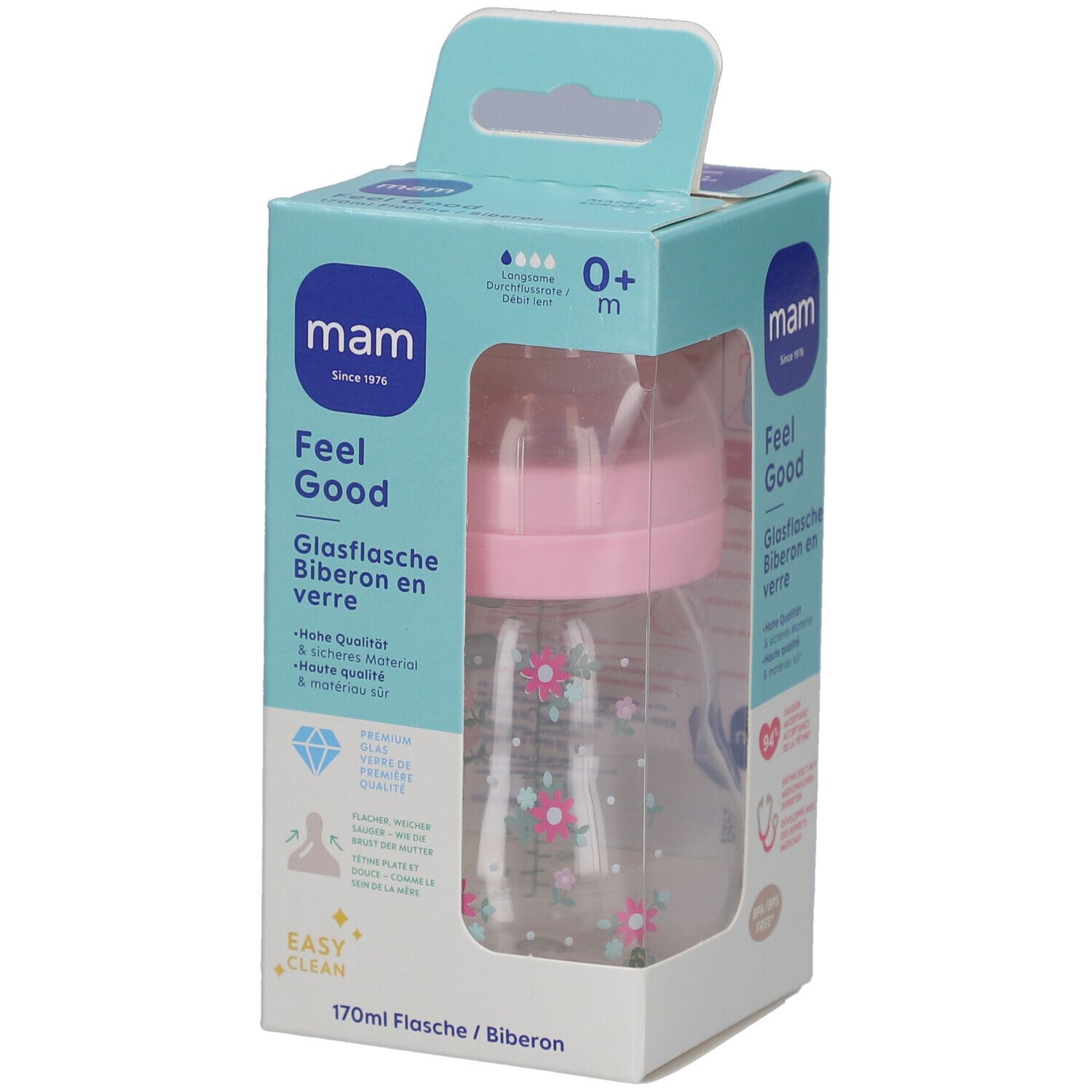 Biberon dans son emballage. Tétine rose, bouteille transparente à motifs floraux. Emballage avec nom et logo du produit.