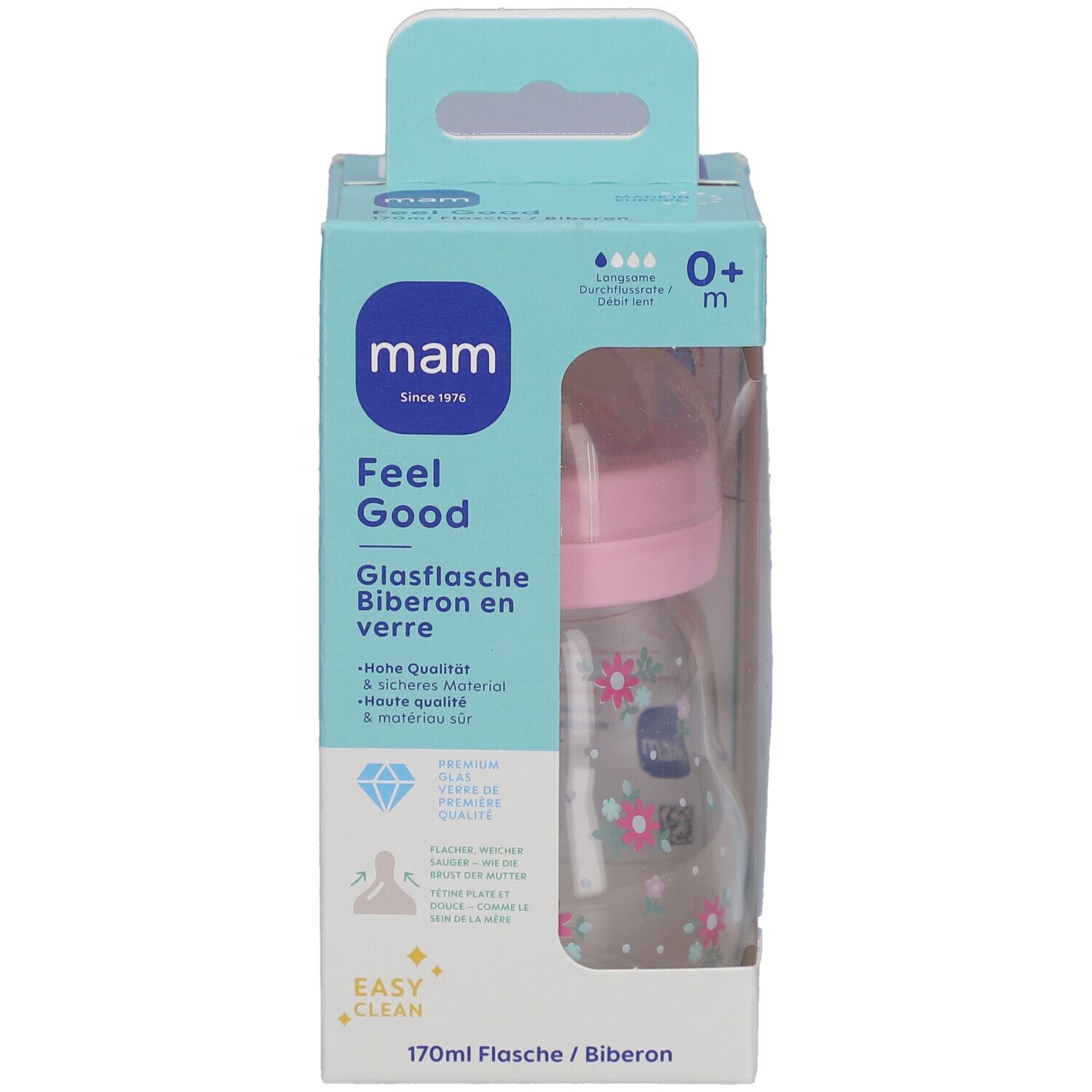 Biberon dans son emballage. Tétine rose, bouteille transparente à motifs floraux. Emballage avec nom et logo du produit.