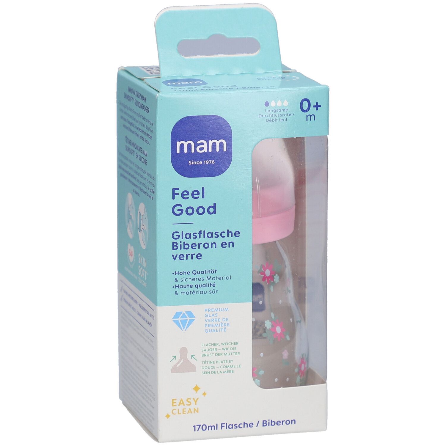 Biberon dans son emballage. Tétine rose, bouteille transparente à motifs floraux. Emballage avec nom et logo du produit.