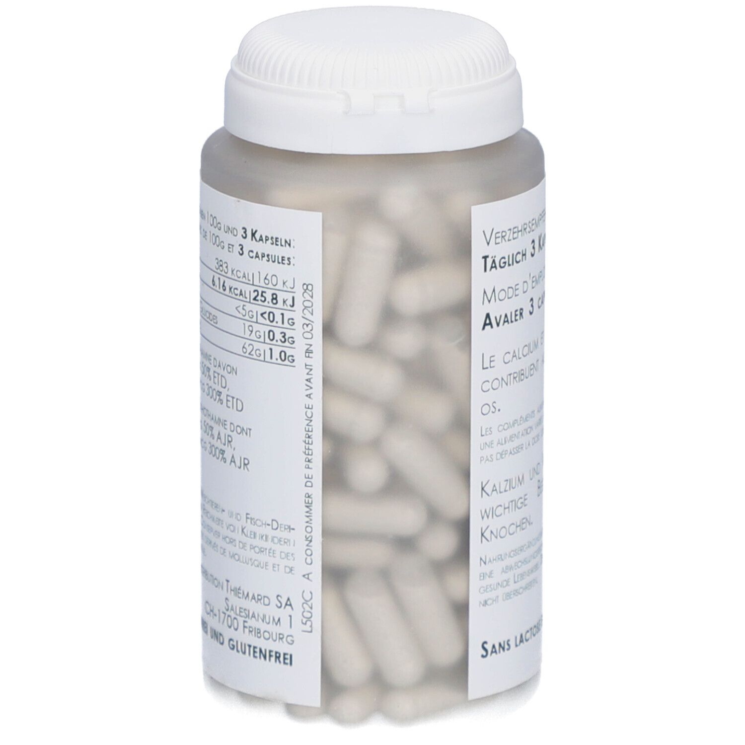 Weißer Pillenbehälter, teilweise gefüllt mit Kapseln. Aufschrift in Deutsch und Französisch. Sichtbare Kapseln.