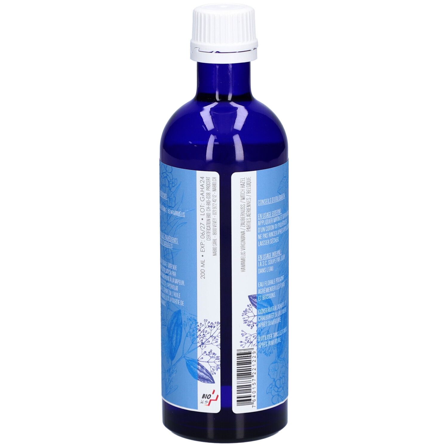 Blaue Glasflasche. Rückseite mit Text und Barcode. Aufschrift: HAMAMÉLIS, EAU FLORALE BIO. Floral-Design.