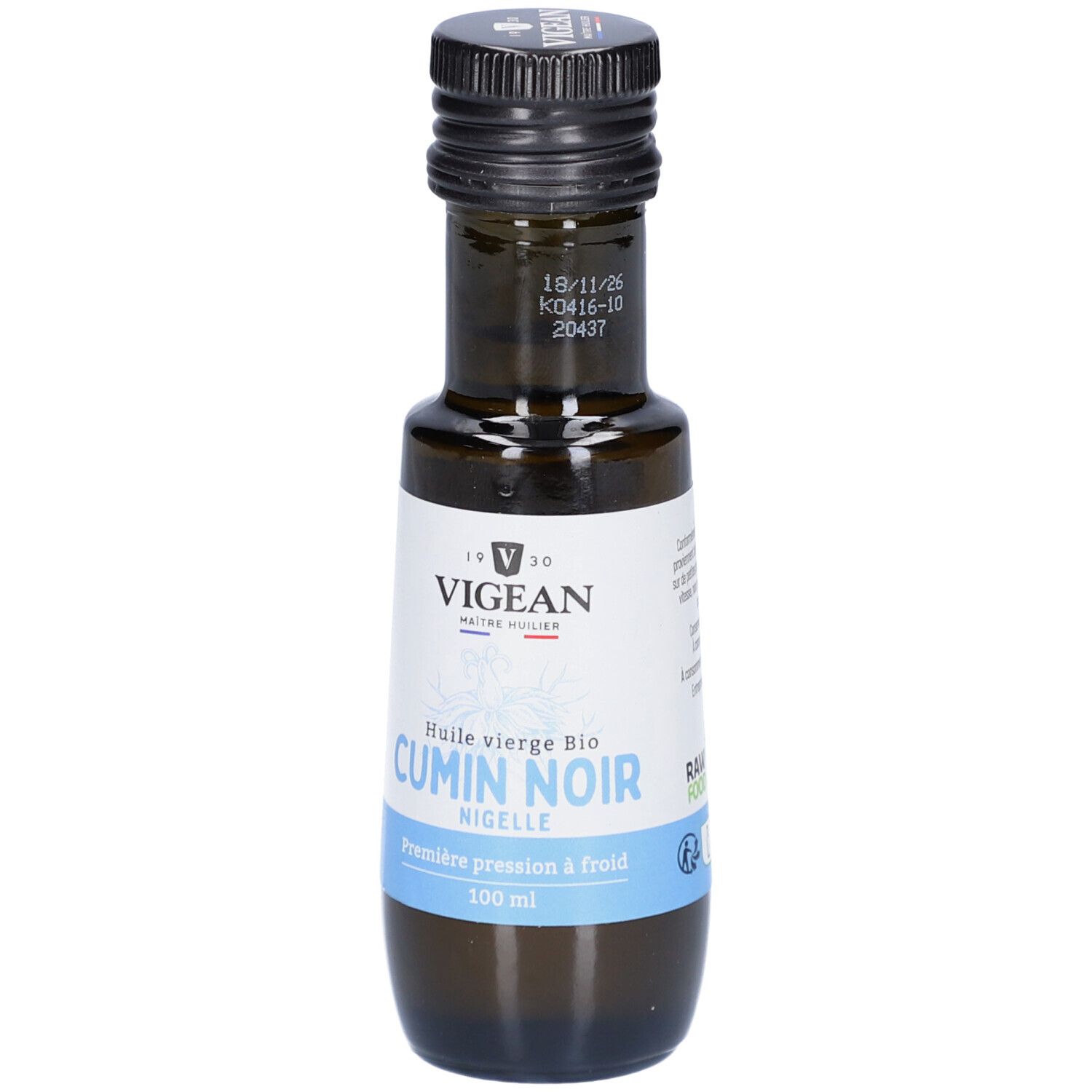 Braune Glasflasche mit schwarzem Deckel. Etikett mit "VIGEAN" und "CUMIN NOIR". Blaue Banderole mit Text. 100 ml.