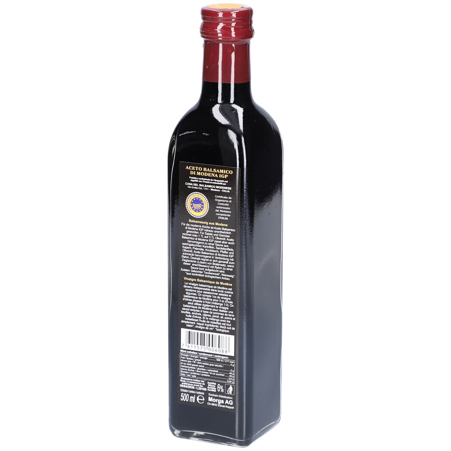 Dunkle Glasflasche mit rotem Verschluss. Rückseite mit Etikett und Text. 500 ml. Morga AG.