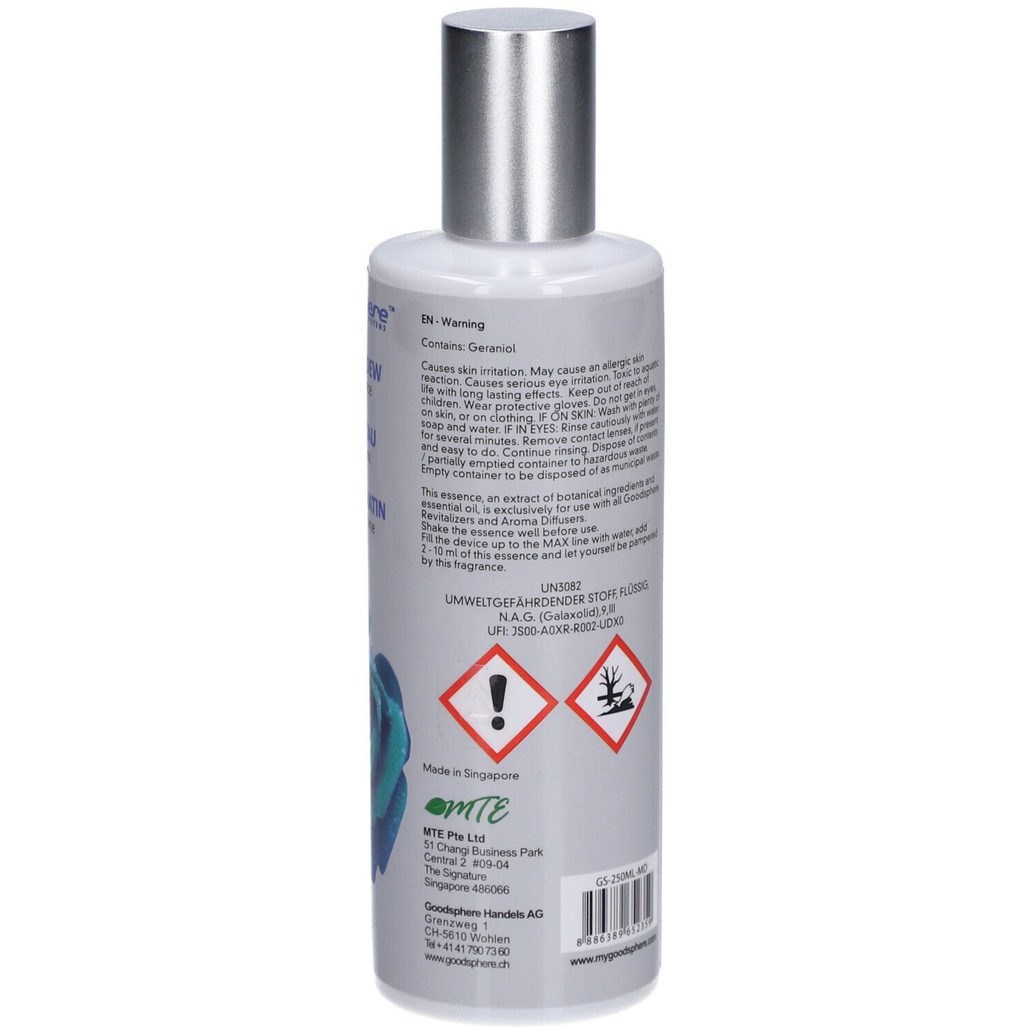 Dos du flacon. Texte multilingue. Contient du géraniol. Symboles de danger. Informations du fabricant. Fabriqué à Singapour.
