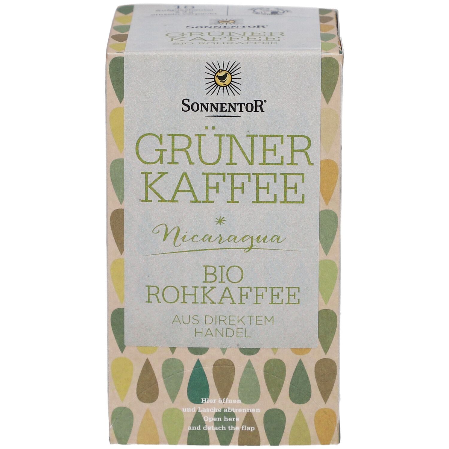 Sonnentor Grüner Kaffee Verpackung. Aufschrift: Grüner Kaffee, Nicaragua, Bio Rohkaffee. Tropfenmuster in Grün- und Beigetönen.
