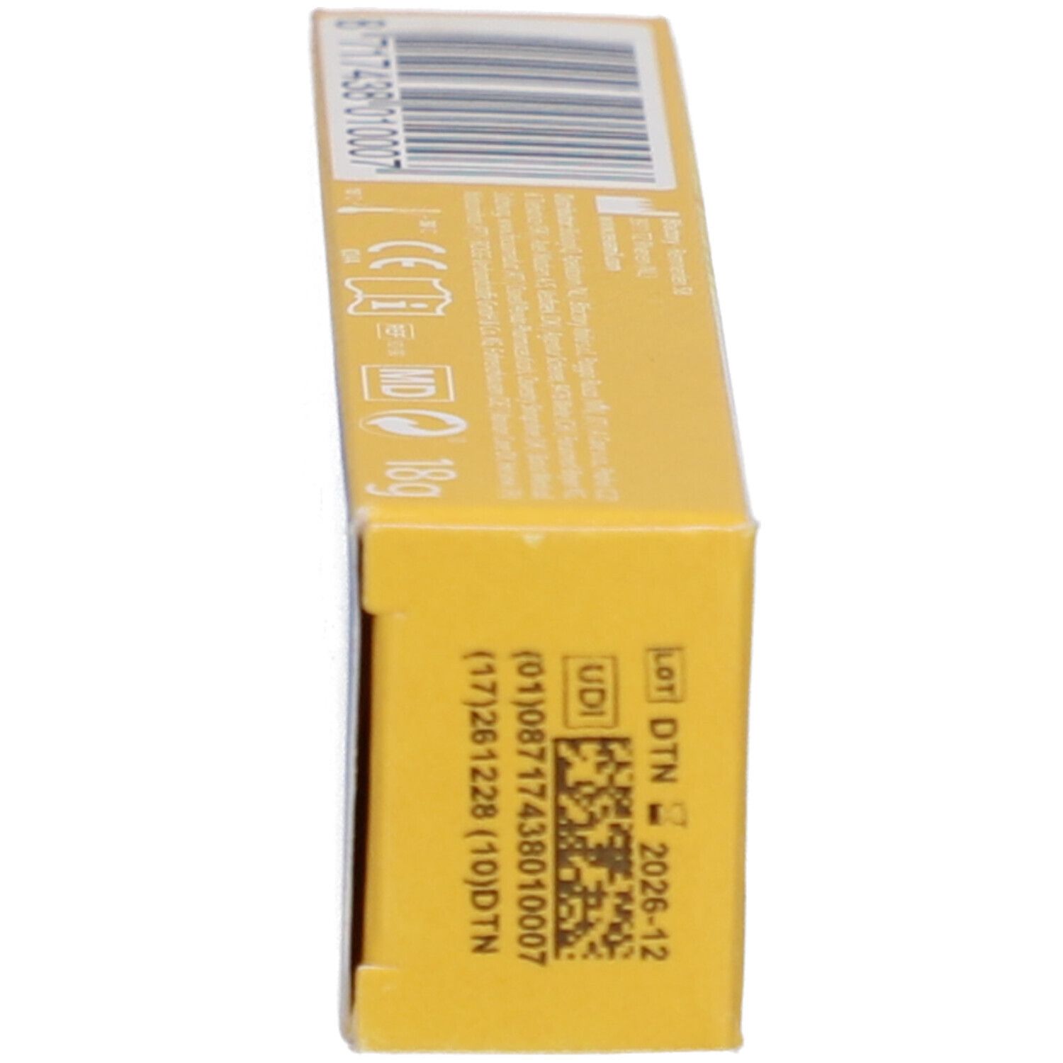 Schachtel, Seitenansicht. Aufschrift: Revamil, Barcode, UDI, LOT, DTN, MD.