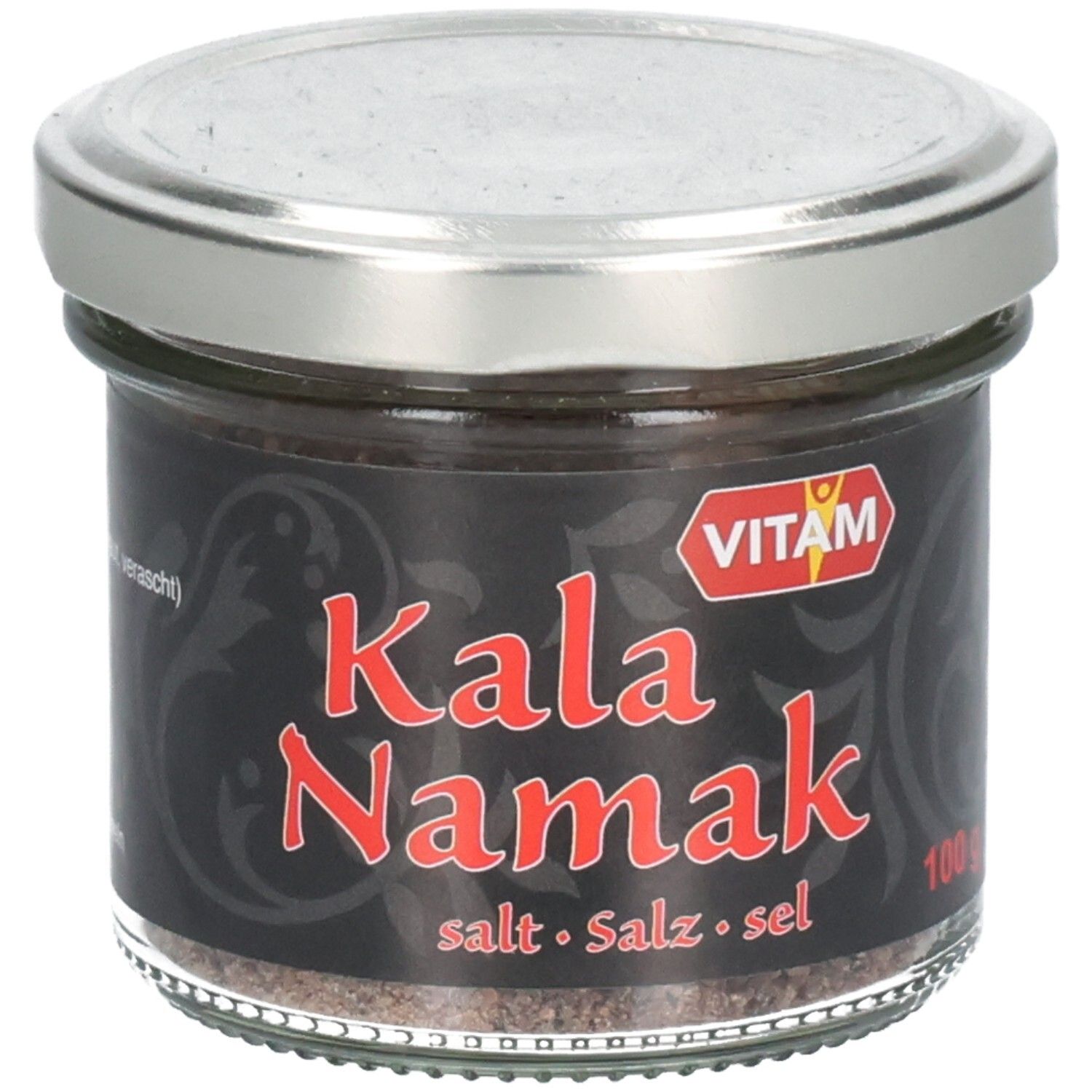 Pot en verre avec étiquette noire. Inscription rouge "Kala Namak". Marque VITAM. Couvercle argenté. Sel visible.