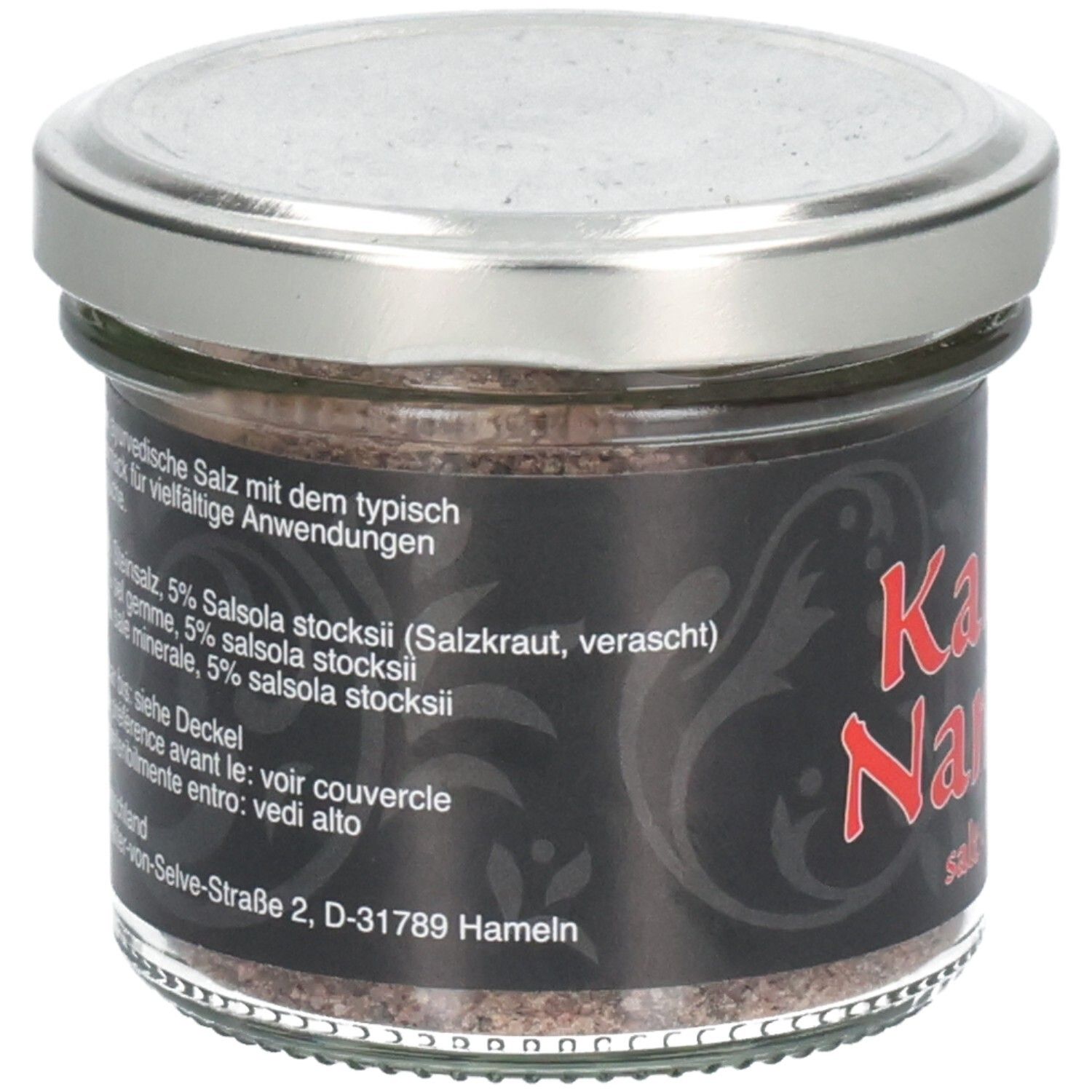 Pot en verre avec étiquette noire. Texte en allemand, liste des ingrédients. Couvercle argenté. Sel visible.