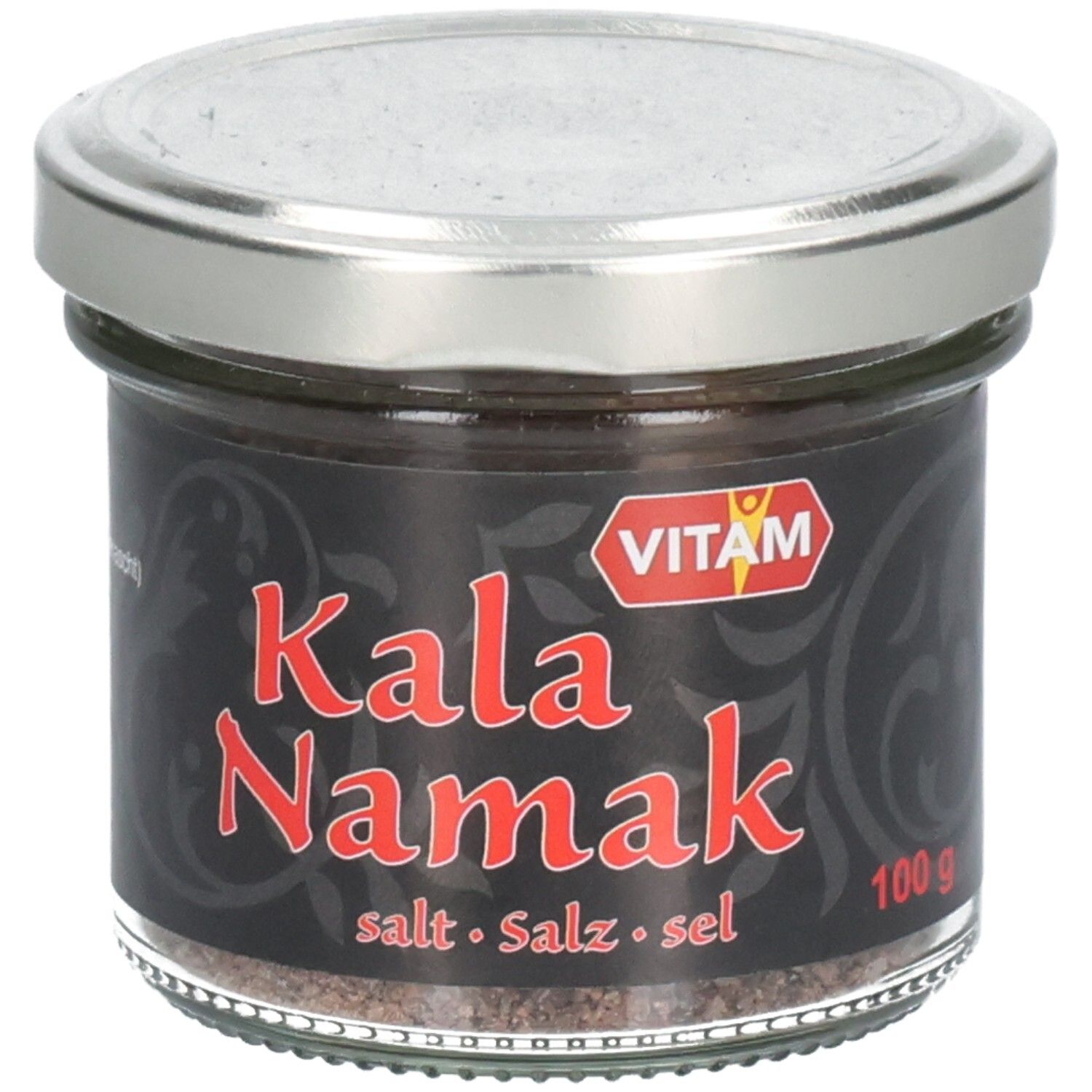 Pot en verre avec étiquette noire. Inscription rouge "Kala Namak". Marque VITAM. Couvercle argenté. Sel visible.