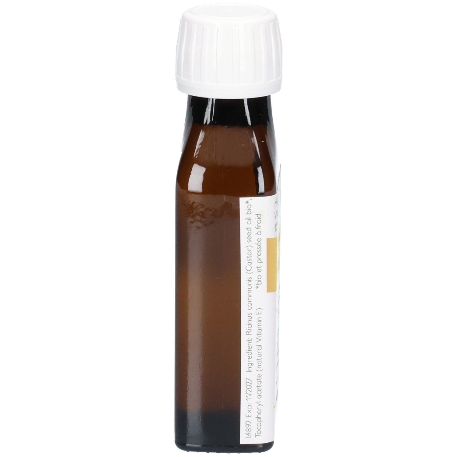 Braune Glasflasche mit weißem Schraubverschluss, gefüllt mit Rizinusöl. Etikett mit Inhaltsstoffen und Haltbarkeitsdatum.