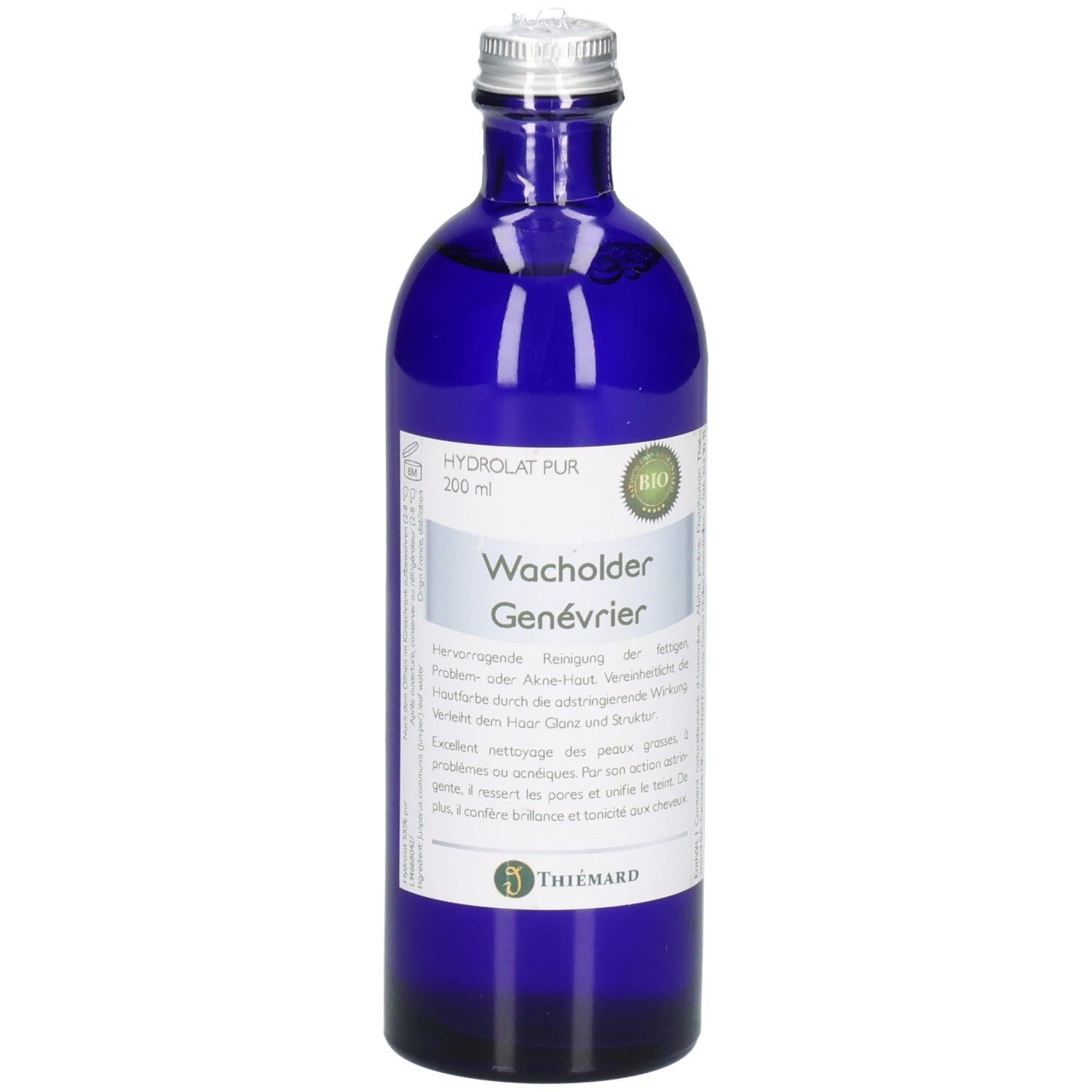 Bouteille en verre bleu avec bouchon argenté, étiquette "Wacholder Genévrier BIO".