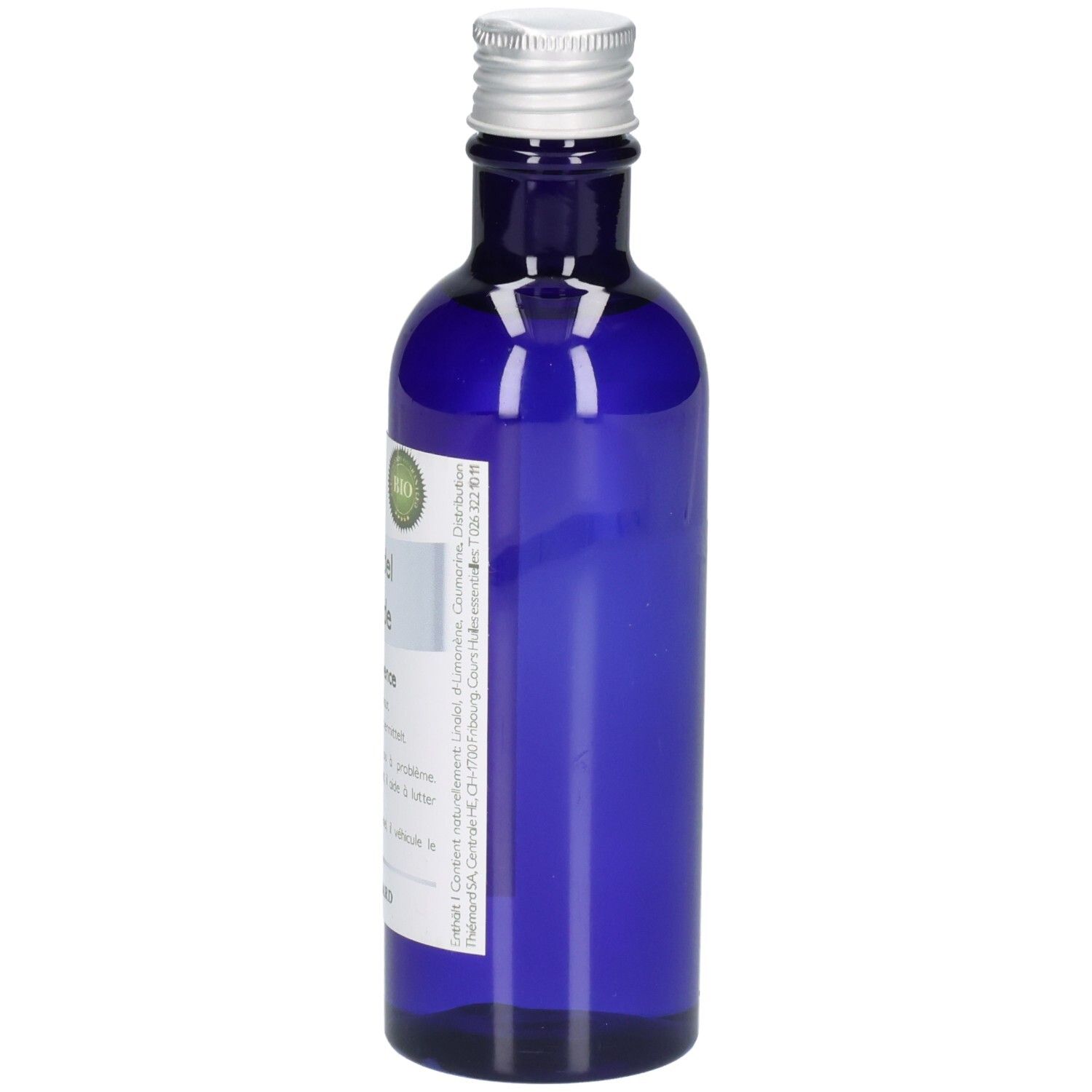 Blaue Glasflasche mit silbernem Schraubverschluss und Etikett.