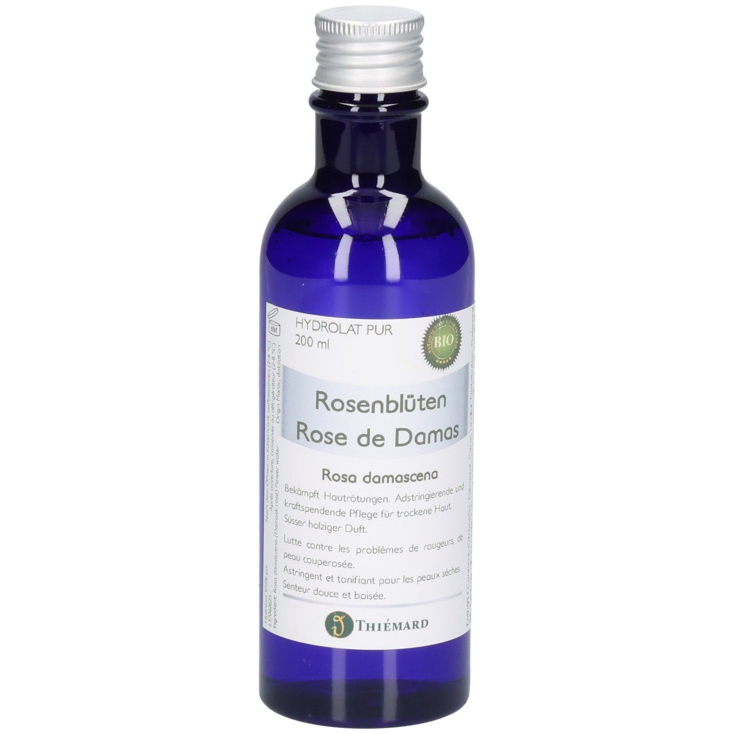 Blaue Glasflasche mit silbernem Verschluss, gefüllt mit Rosenblütenwasser (200 ml). Bio-Siegel und "Thiemard"-Logo sichtbar.