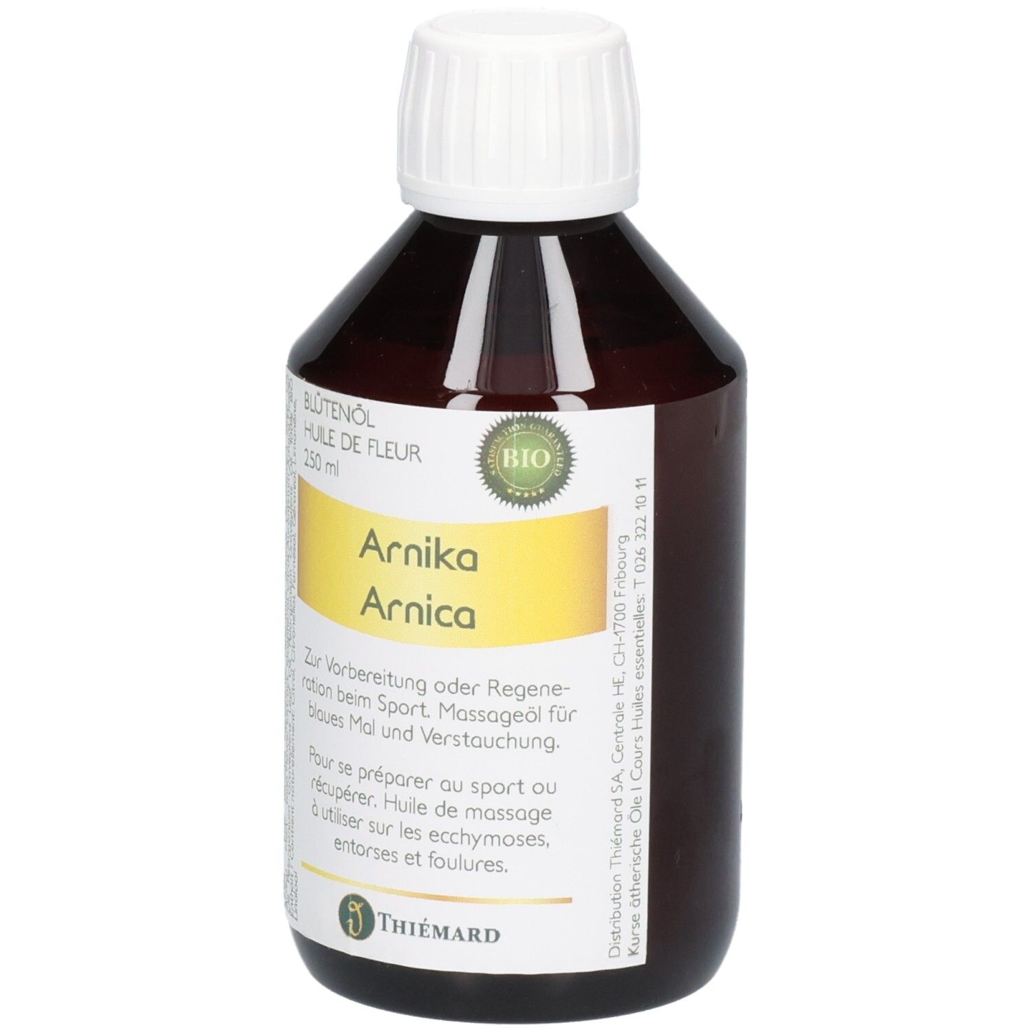 Braune Glasflasche mit weißem Schraubverschluss, gefüllt mit Arnikaöl. Gelbes Etikett mit Bio-Siegel und Produktinformationen.