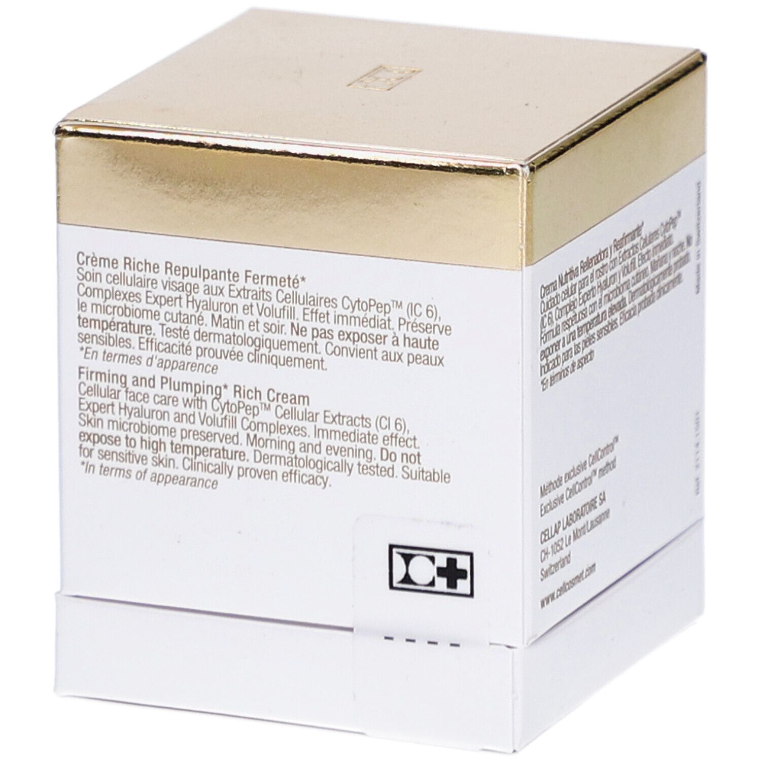Boîte blanche et dorée. Texte: Crème Riche Repulpante Fermeté. Firming and Plumping Rich Cream.