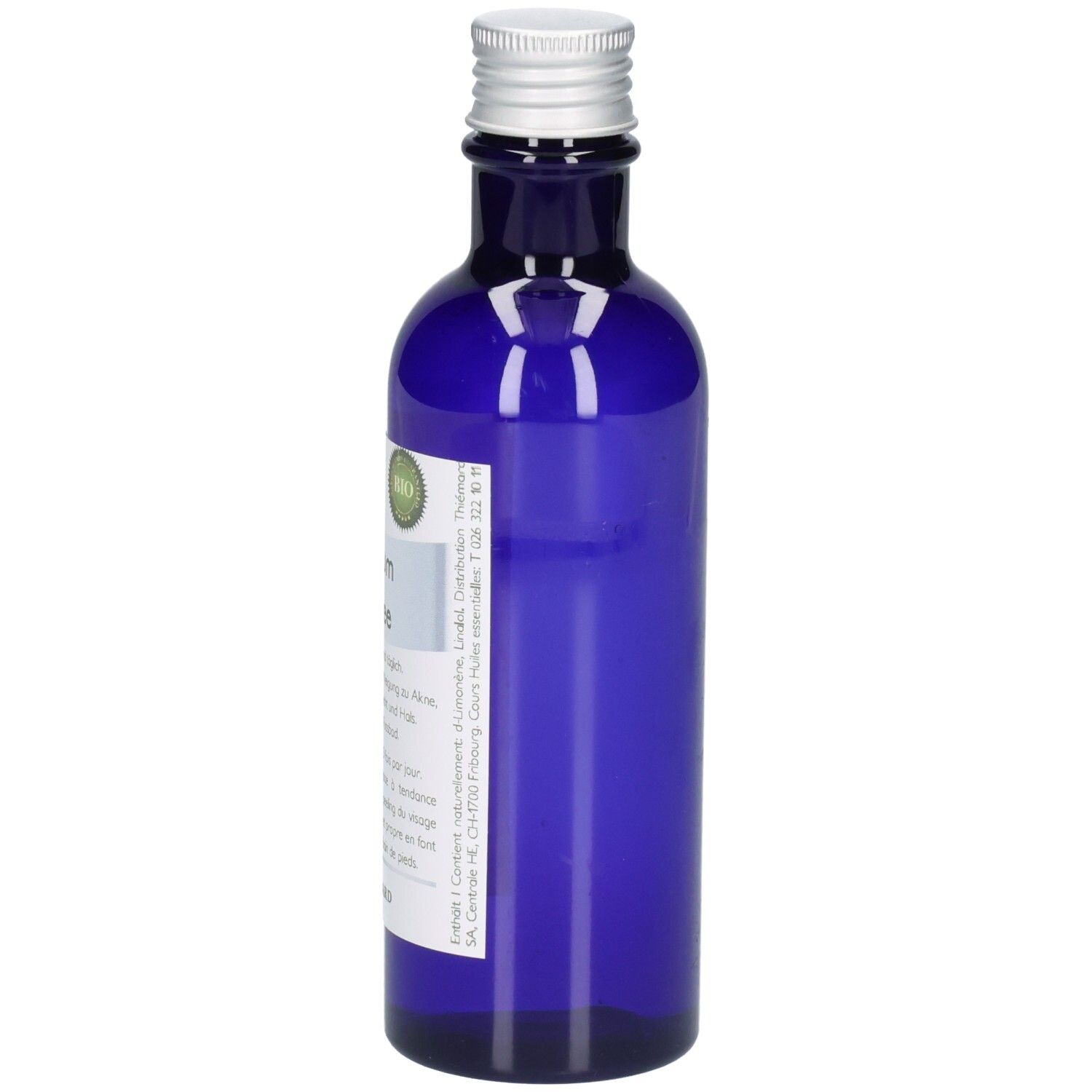 Blaue Glasflasche mit silbernem Verschluss und Etikett. Enthält ein grünes Bio-Siegel.