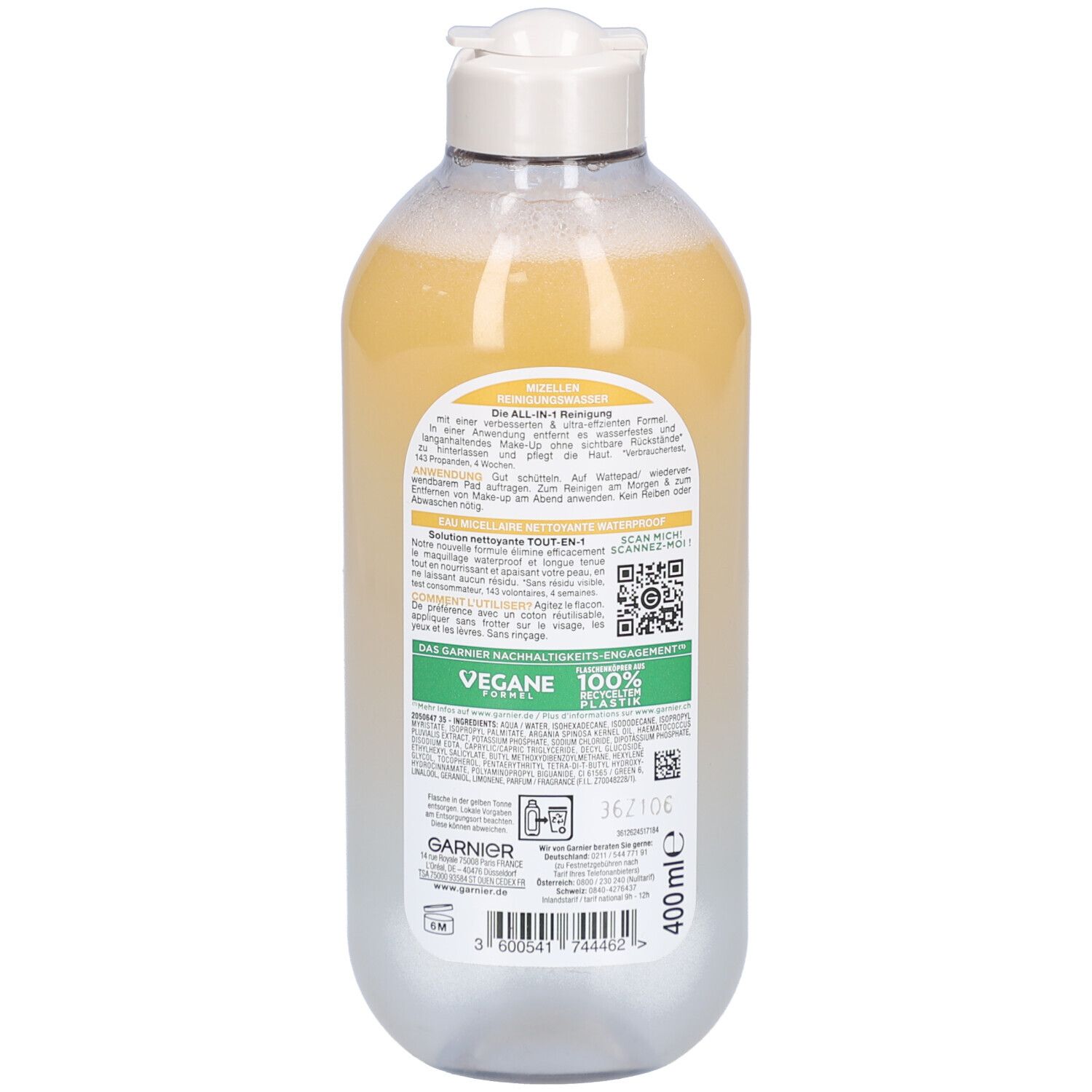 Rückseite der Flasche mit gelblicher Flüssigkeit. Weißer Deckel. Aufschrift Garnier. Text und QR-Code. Vegan-Siegel. 100% recyceltes Plastik.
