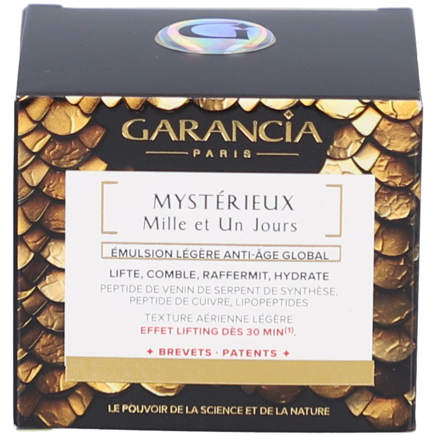 Boîte noire avec motif doré. Inscription: GARANCIA PARIS, Mystérieux Mille et Un Jours, Émulsion légère anti-âge global.