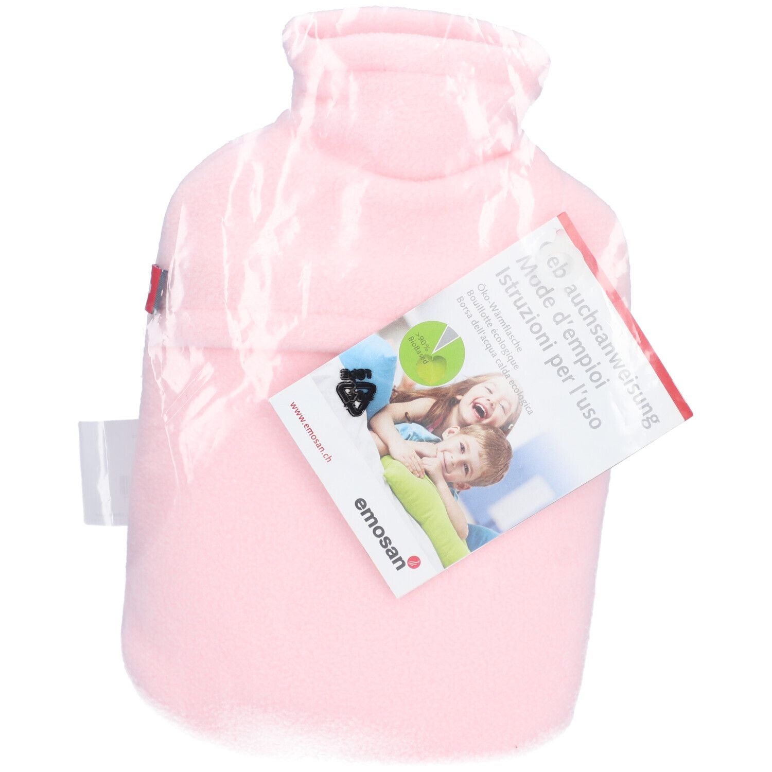 Rosa Wärmflasche in Folie. Mit Etikett: Gebrauchsanweisung, Marke Emosan. Aufdruck: Kinder. Zertifizierung.