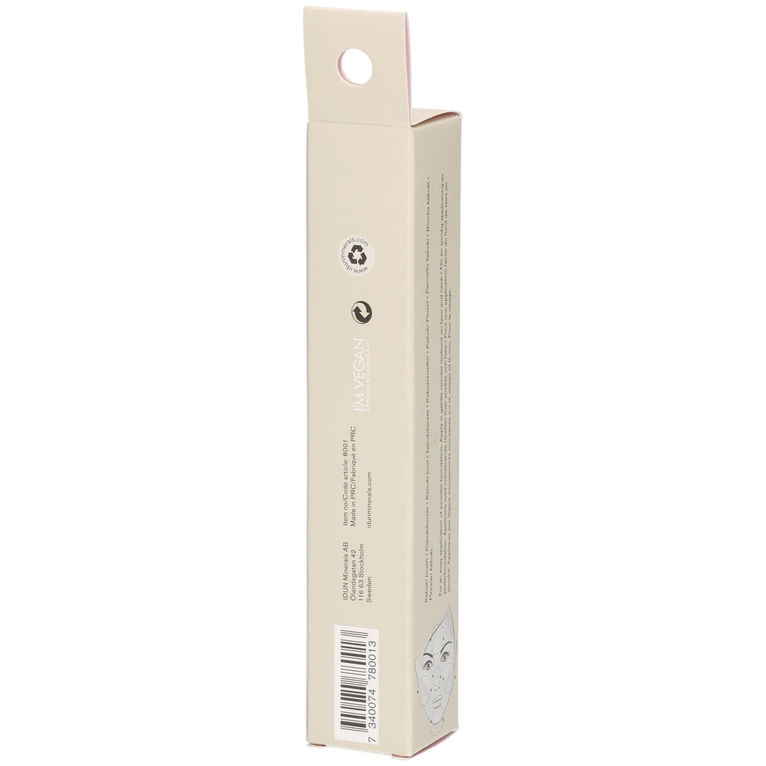 Schmale, beige Pappverpackung mit Aufhängeloch. Enthält Text und eine stilisierte Gesichtszeichnung.