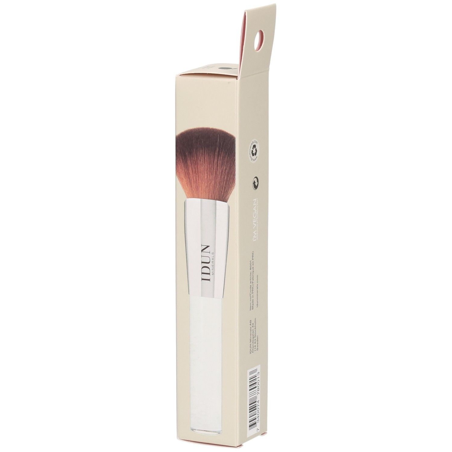 Ein Make-up-Pinsel mit weißem Griff und braunen Borsten in einer Pappverpackung mit der Aufschrift "IDUN".