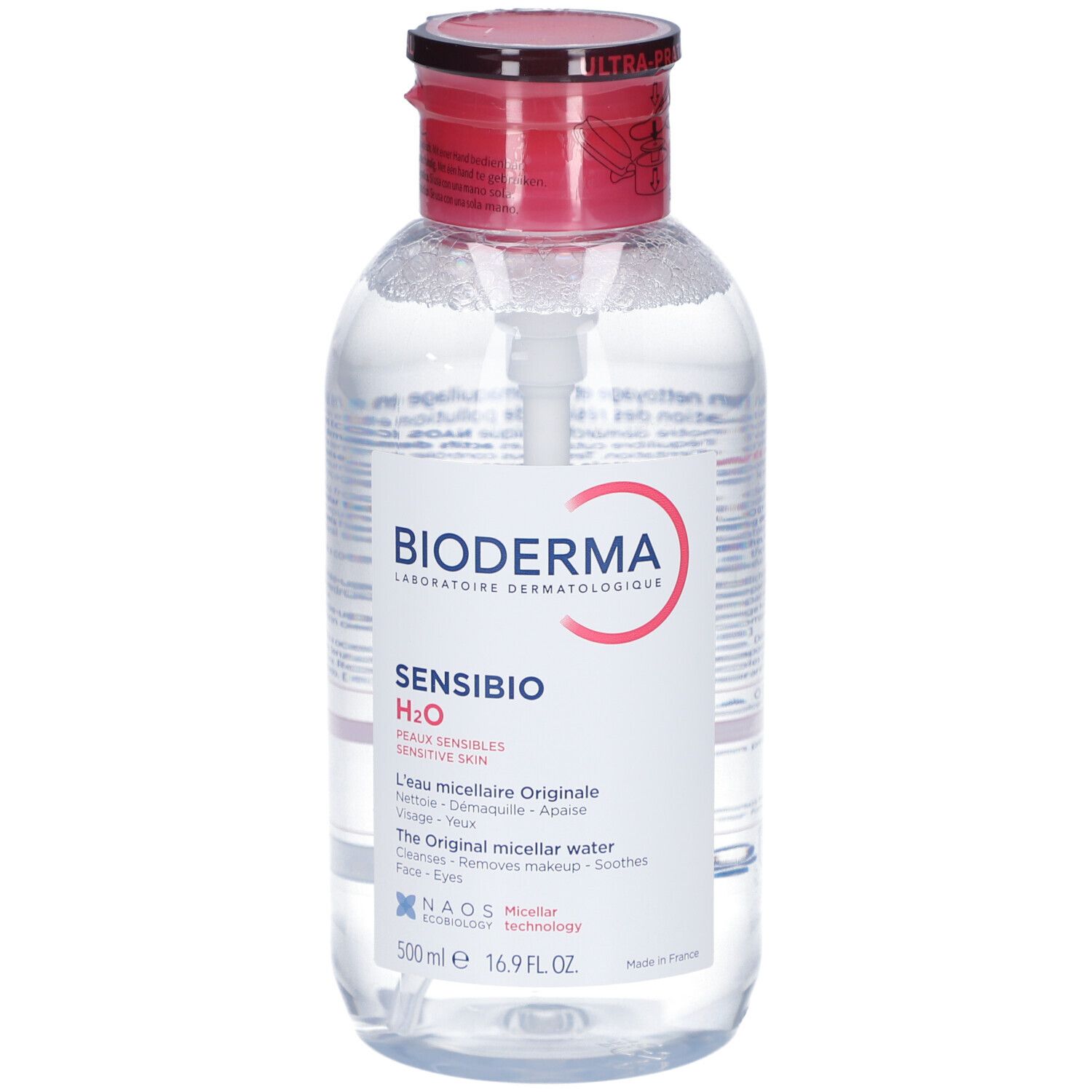Klare Flüssigkeit in einer Flasche mit rotem Deckel und weißer Pumpe. Aufschrift: BIODERMA Sensibio H2O. Mizellares Reinigungswasser.