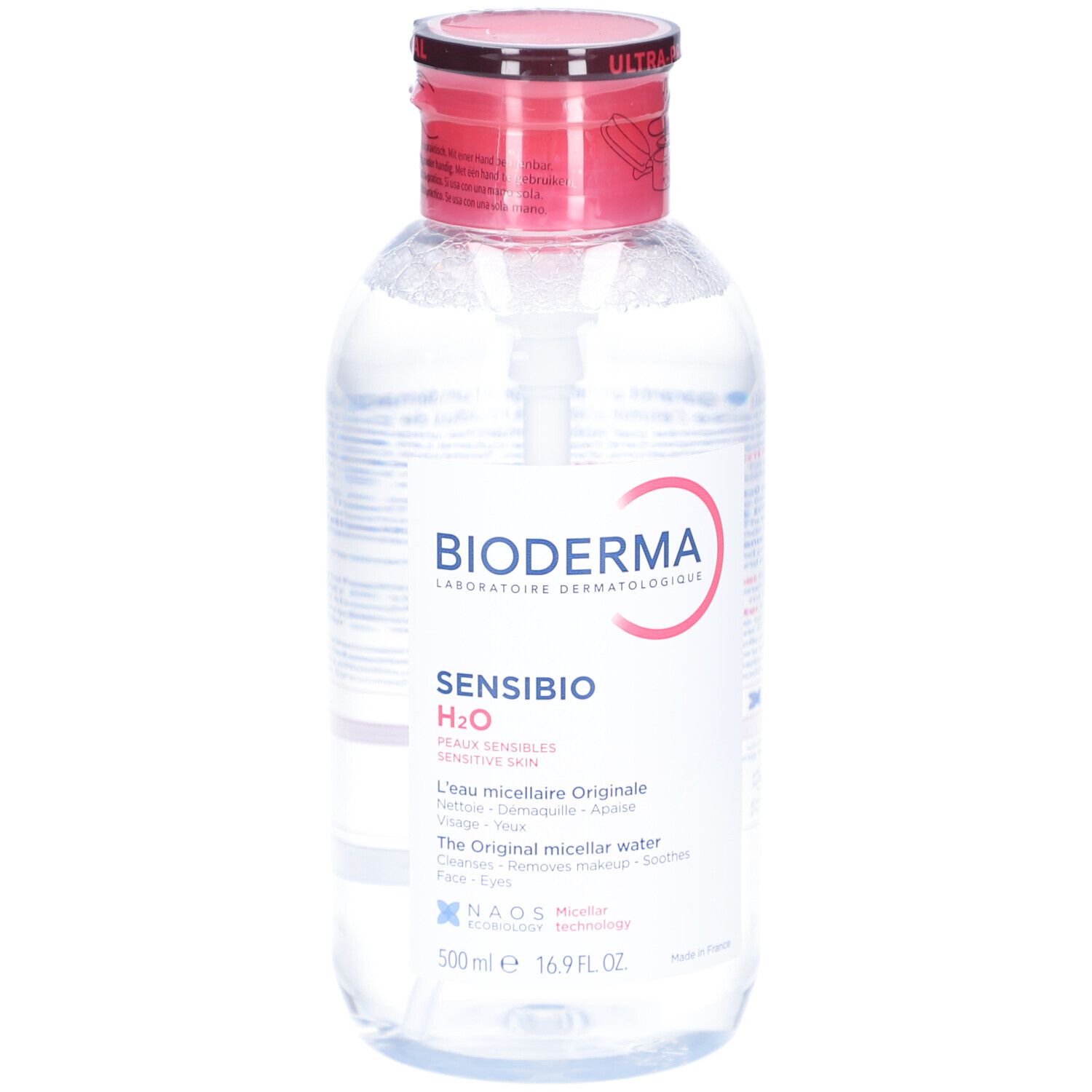 Klare Flüssigkeit in einer Flasche mit rotem Deckel und weißer Pumpe. Aufschrift: BIODERMA Sensibio H2O. Mizellares Reinigungswasser.