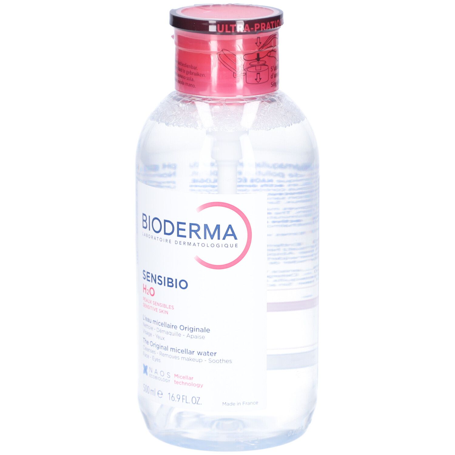 Klare Flüssigkeit in einer Flasche mit rotem Deckel und weißer Pumpe. Aufschrift: BIODERMA Sensibio H2O. Mizellares Reinigungswasser.