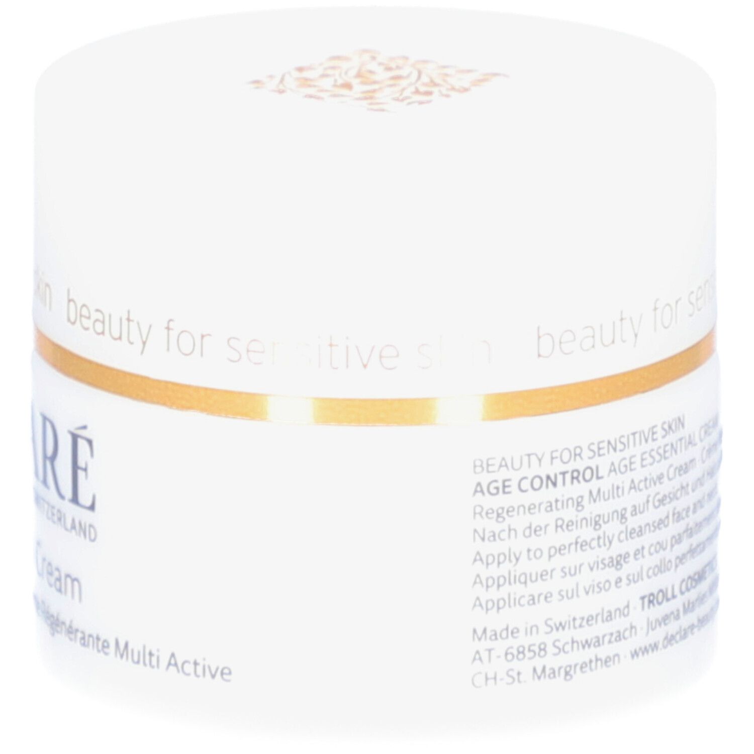 Pot blanc avec anneau doré. Inscription : DECLARÉ, Age Essential Cream. Texte sur le pot.