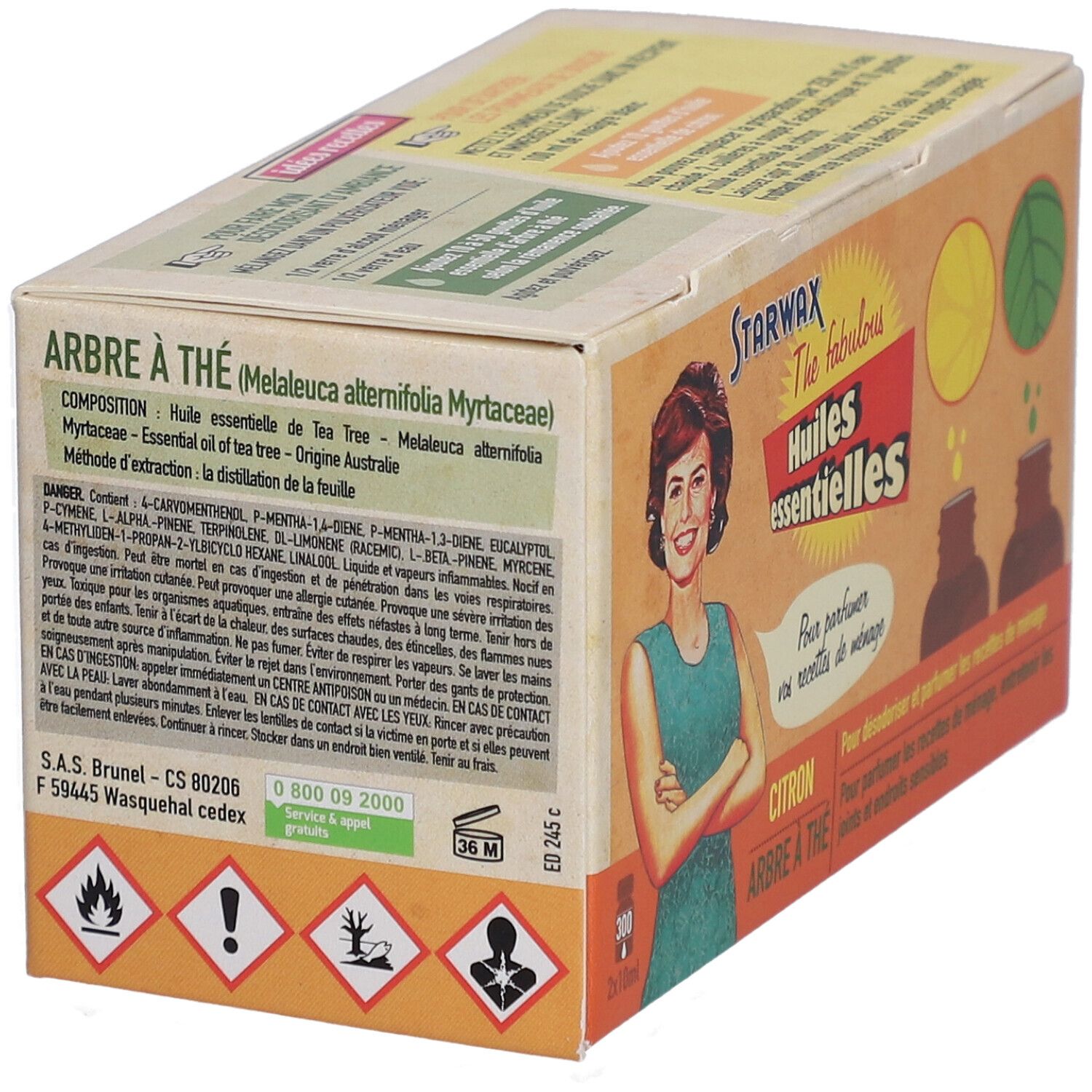 Kartonverpackung mit Produktinformationen. Aufschrift: Arbre à thé, Huiles essentielles. Gefahrensymbole und Inhaltsstoffe.