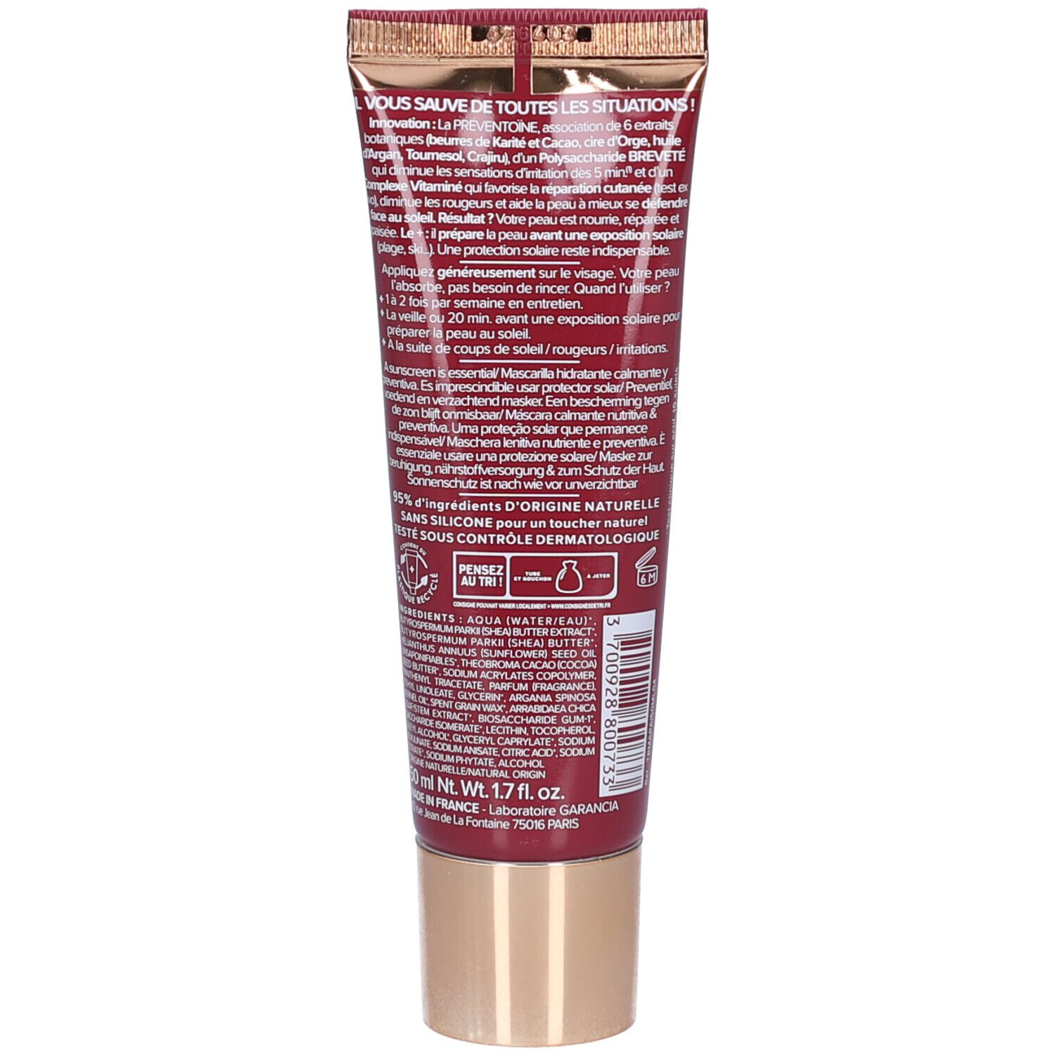 Dos du tube. Texte multilingue. Bouchon doré. Inscription: GARANCIA.