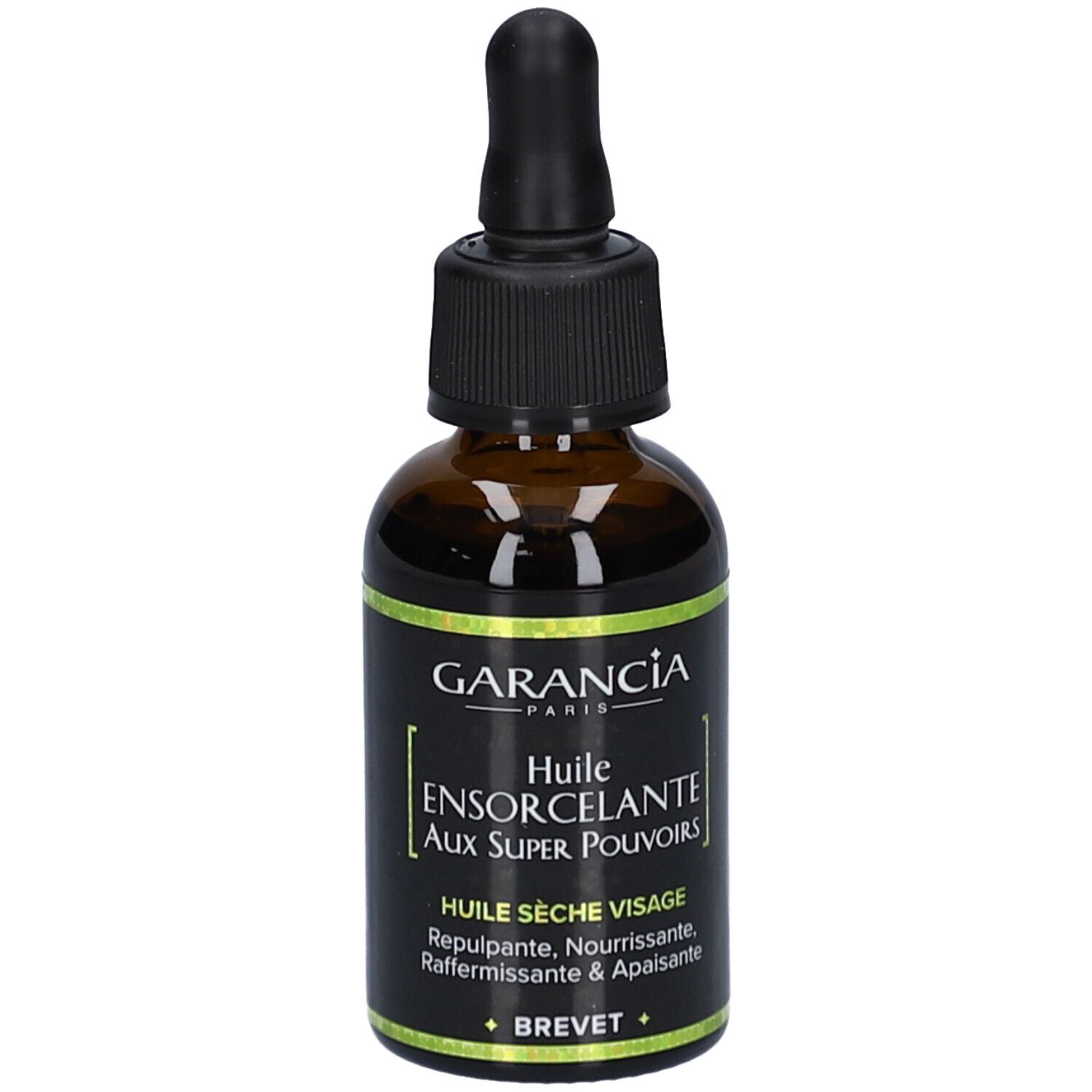 Braune Glasflasche mit schwarzem Deckel und Pipette. Aufschrift: GARANCIA, Huile Ensorcelante Visage aux Super Pouvoirs.