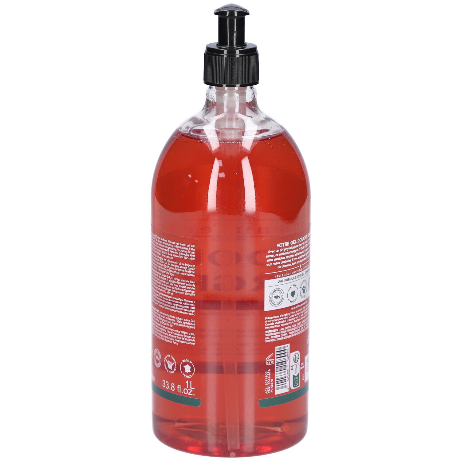 Dos du flacon transparent de gel douche rouge. Pompe noire. Texte et logos. 1L et 33.8 fl.oz.