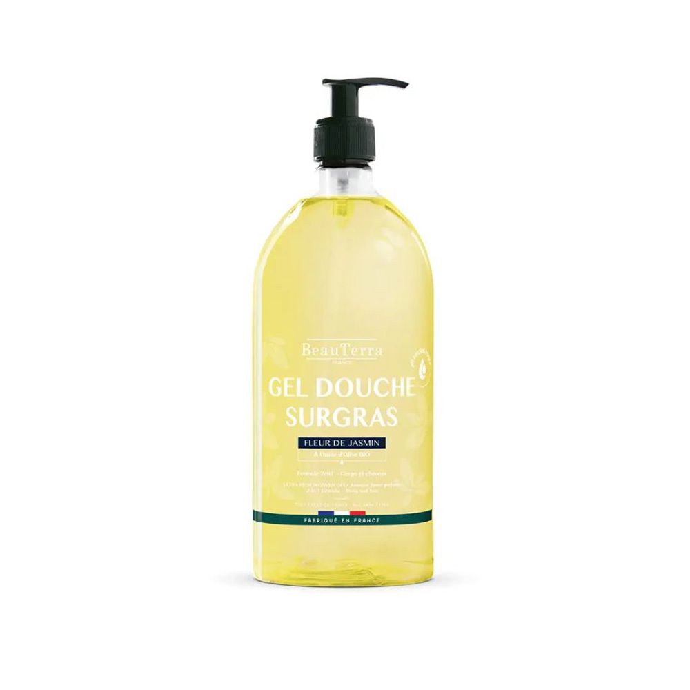 Flacon jaune avec pompe noire. Inscription: Gel Douche Surgras, Fleur de Jasmin. Drapeau français en bas.