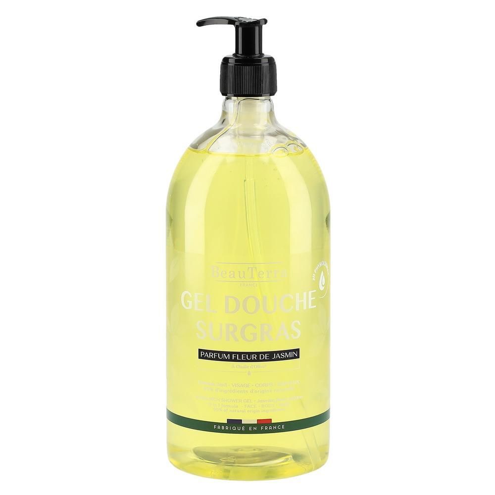 Klare Flasche mit gelbem Duschgel. Schwarzer Pumpspender. Etikett mit Text: Gel Douche Surgras, Parfum Fleur de Jasmin. Französische Flagge.