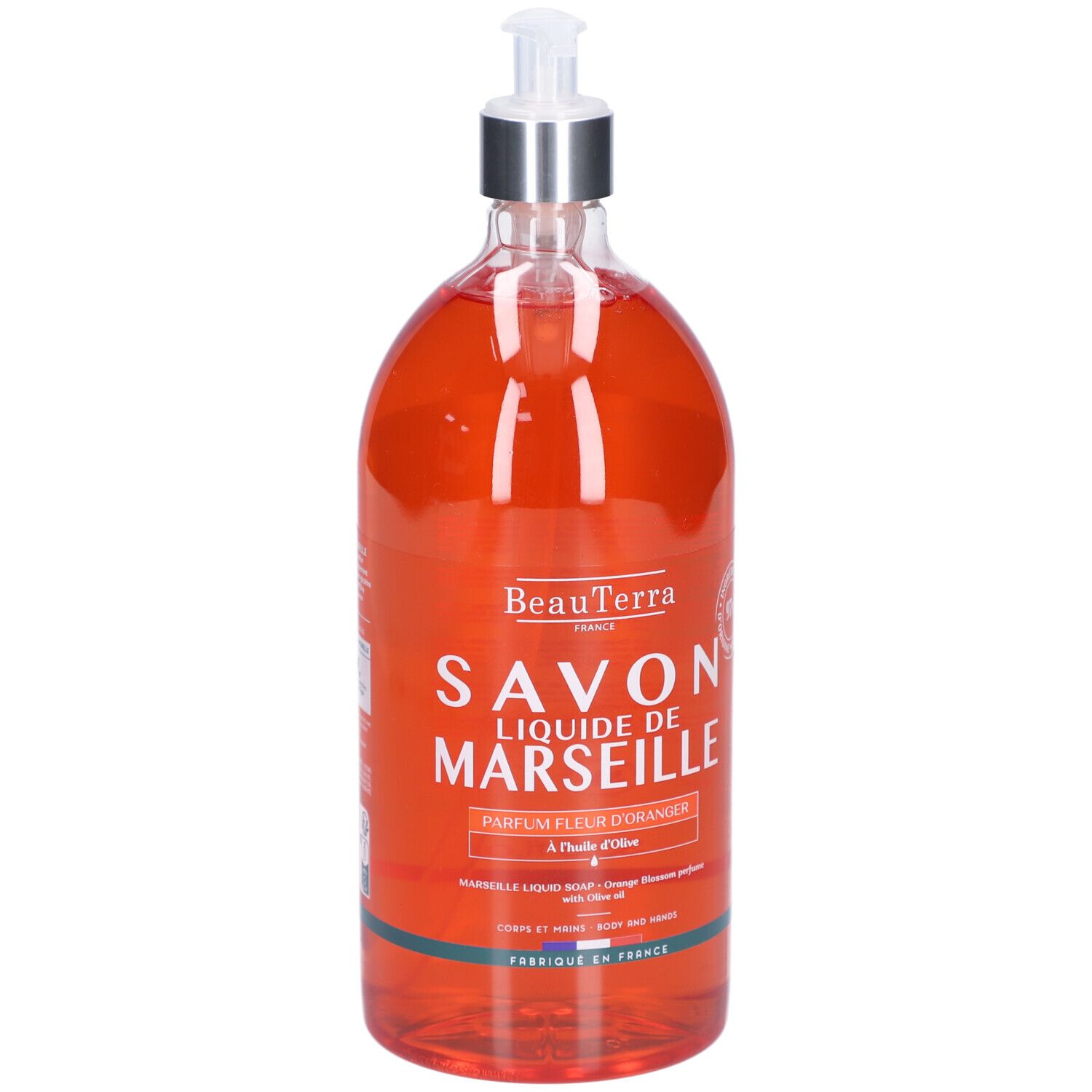 Flacon transparent de savon liquide orange. Inscription: Savon Liquide de Marseille, fleur d'oranger. Avec distributeur.